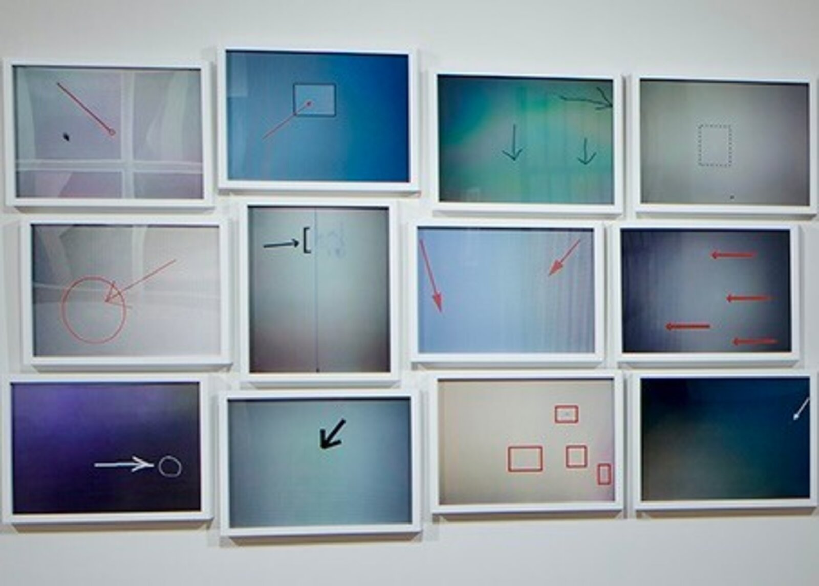 A grid of twelve framed abstract panels featuring geometric shapes, arrows, and soft color gradients.