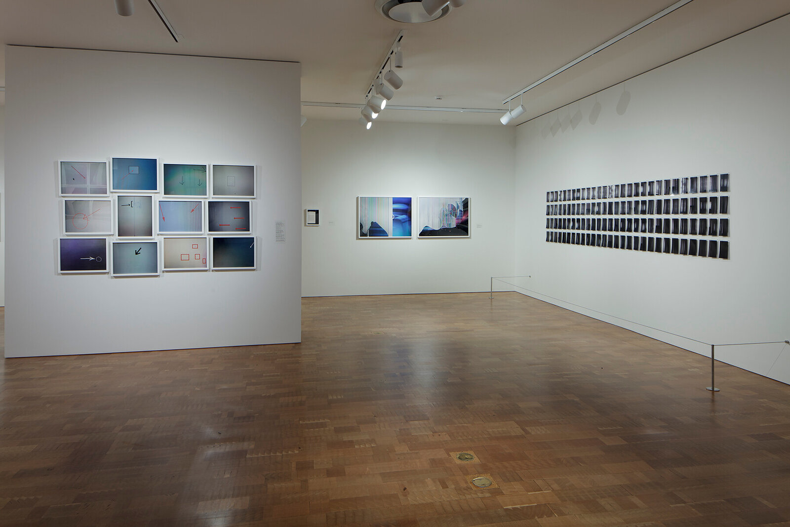 A grid of twelve framed abstract panels featuring geometric shapes, arrows, and soft color gradients.