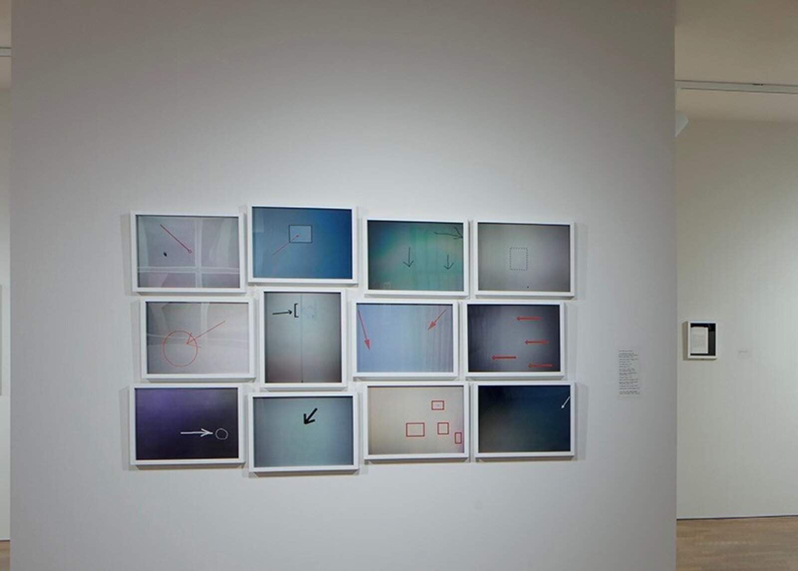 A grid of twelve framed abstract panels featuring geometric shapes, arrows, and soft color gradients.