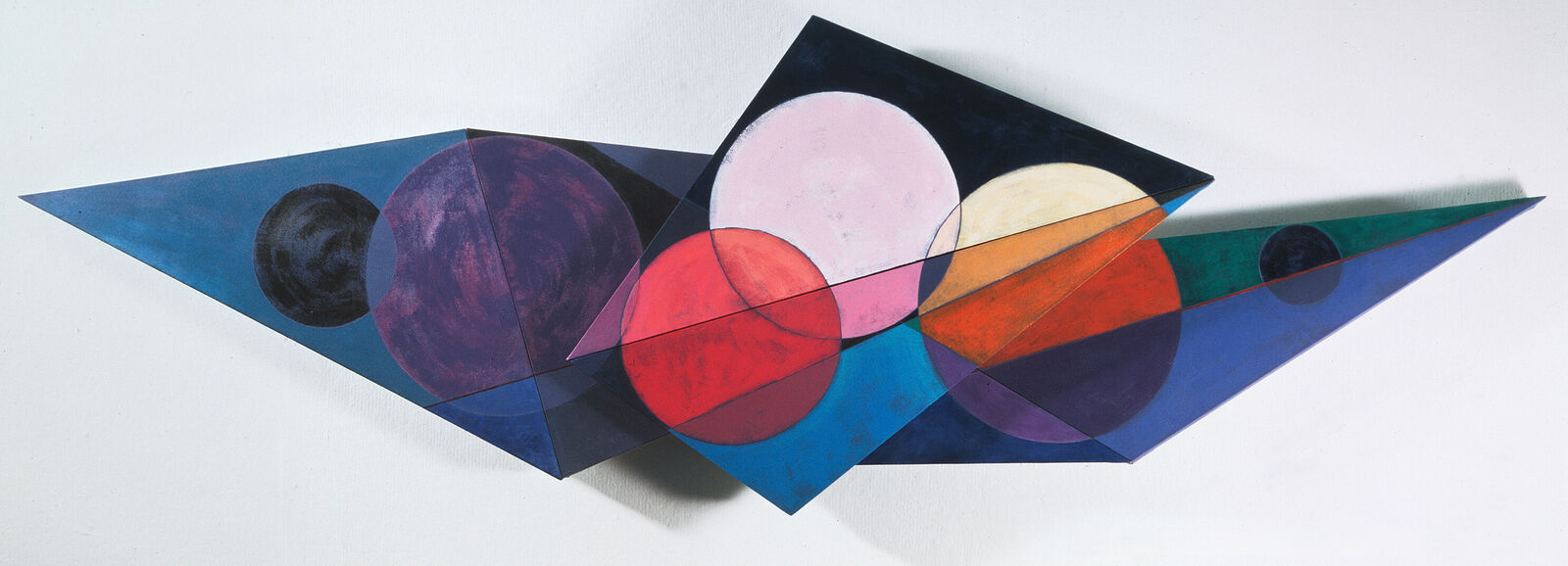 A geometric composition featuring layered triangular planes and overlapping circles in a vibrant, abstract palette.