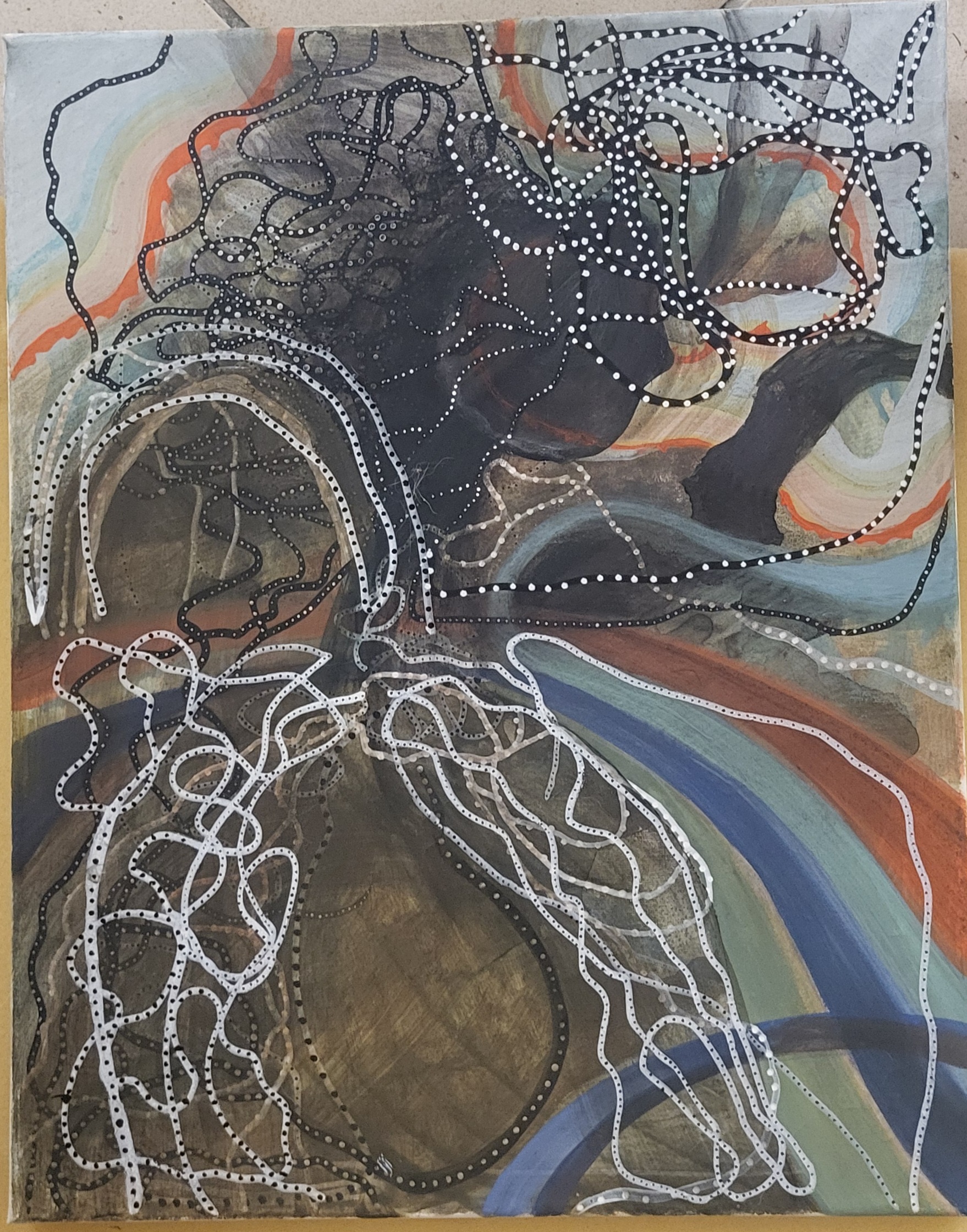 A painting on a piece of paper on a table.