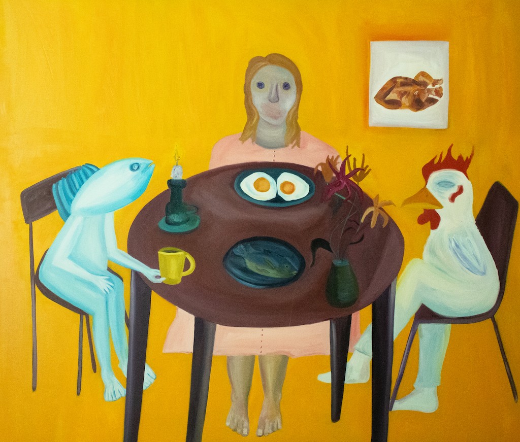 A surreal breakfast scene featuring a human figure and two animal figures sharing a meal at a round table.
