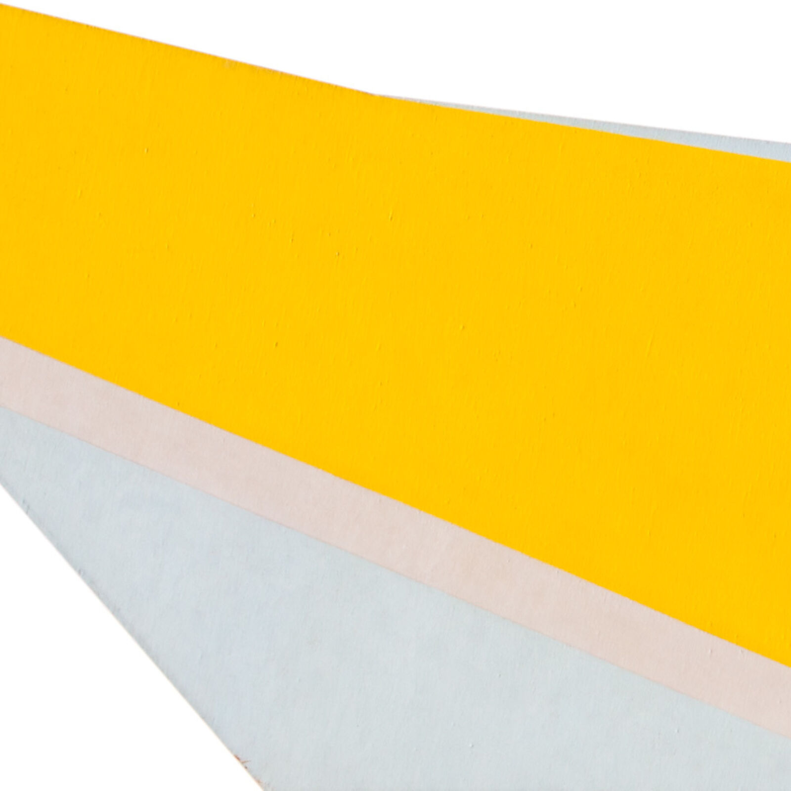 a yellow and white paper airplane on a white background