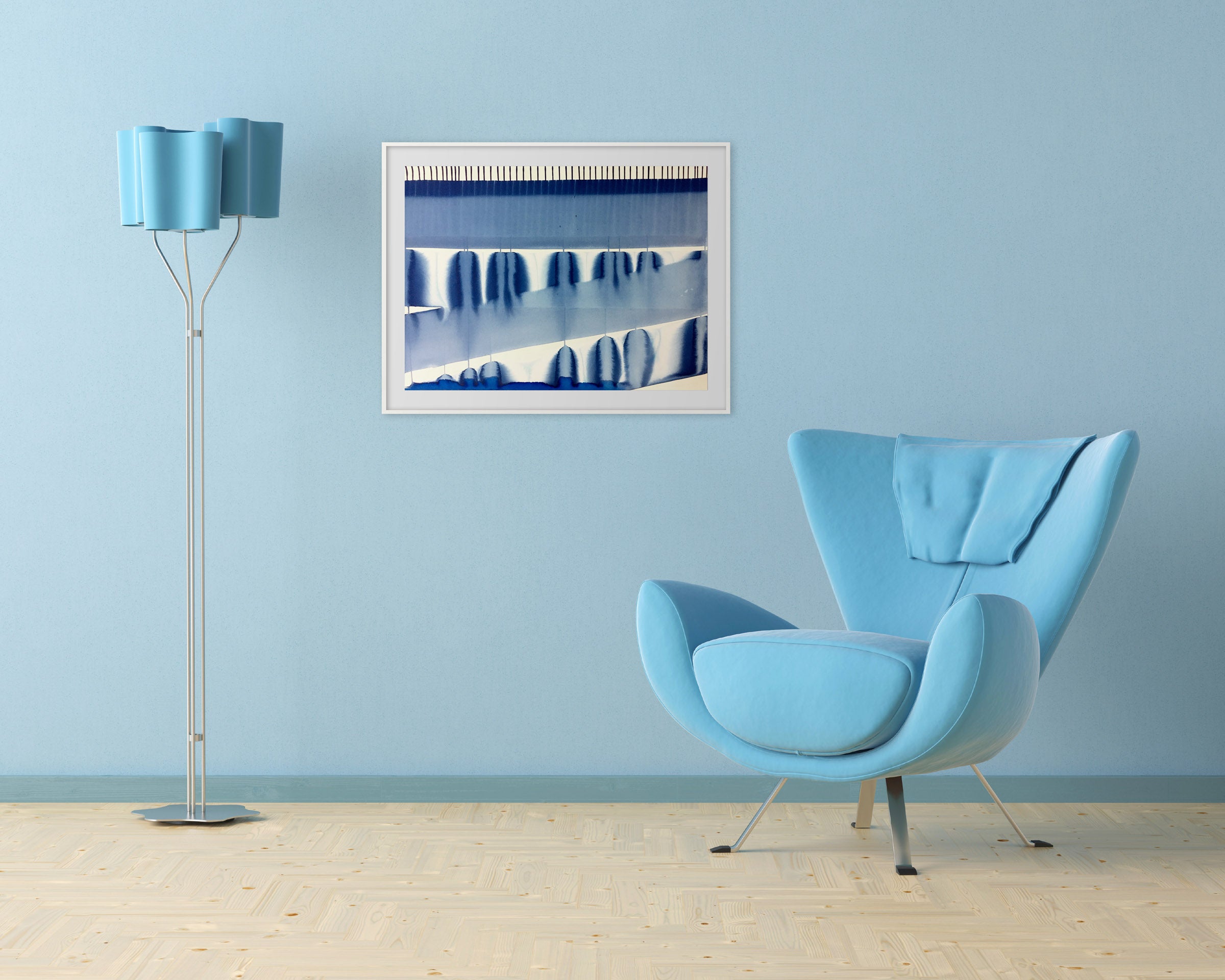 A blue and white painting on a white wall.