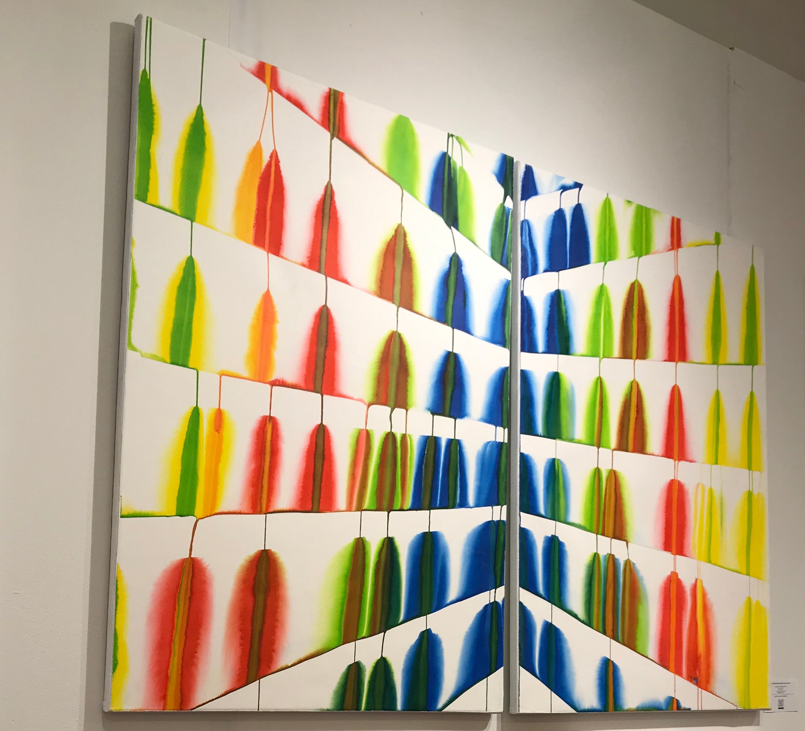 A painting of a colorful pattern on a white background.