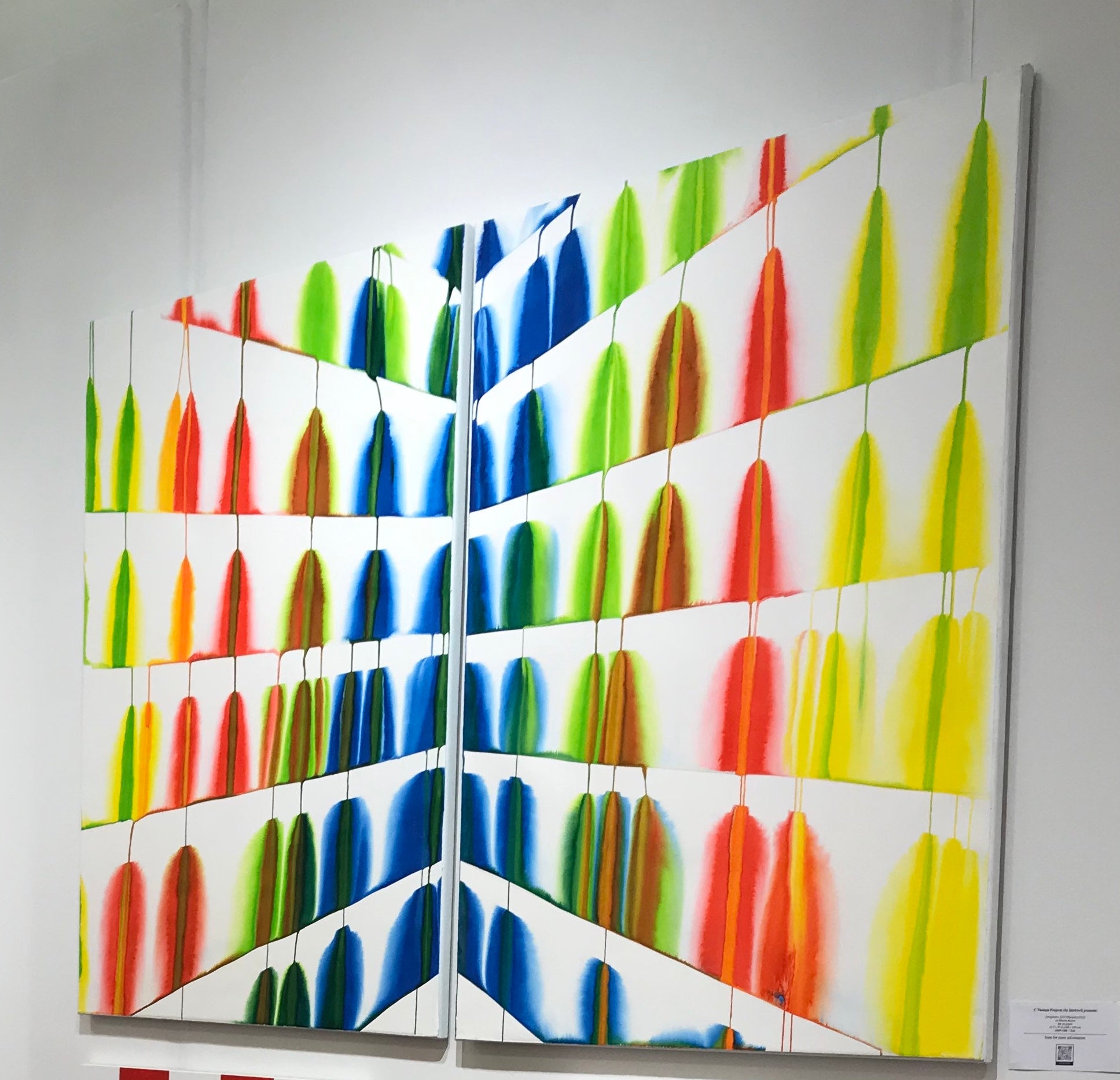 A painting of a colorful pattern on a white background.