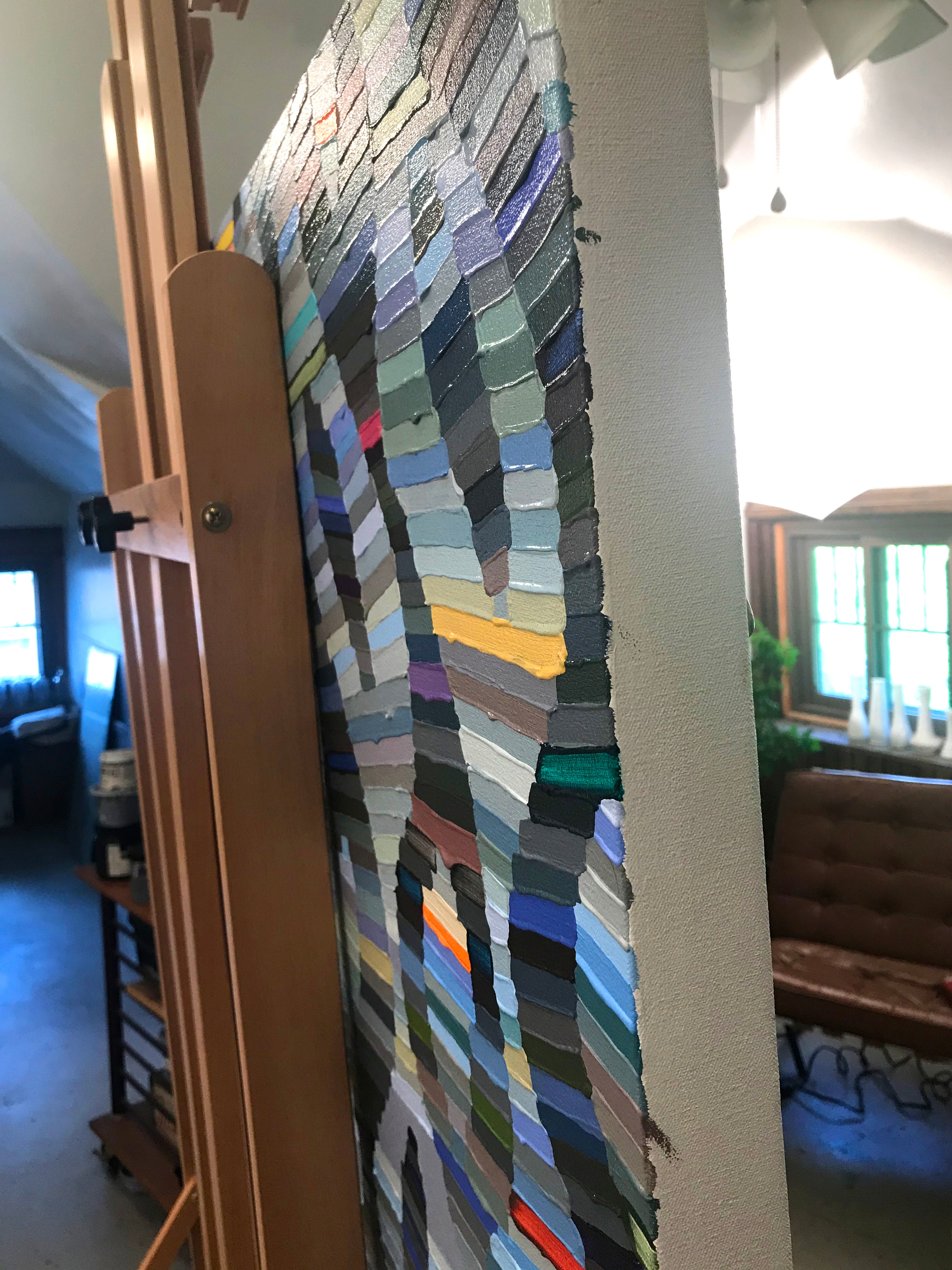 A painting of a pattern made out of strips of paper.