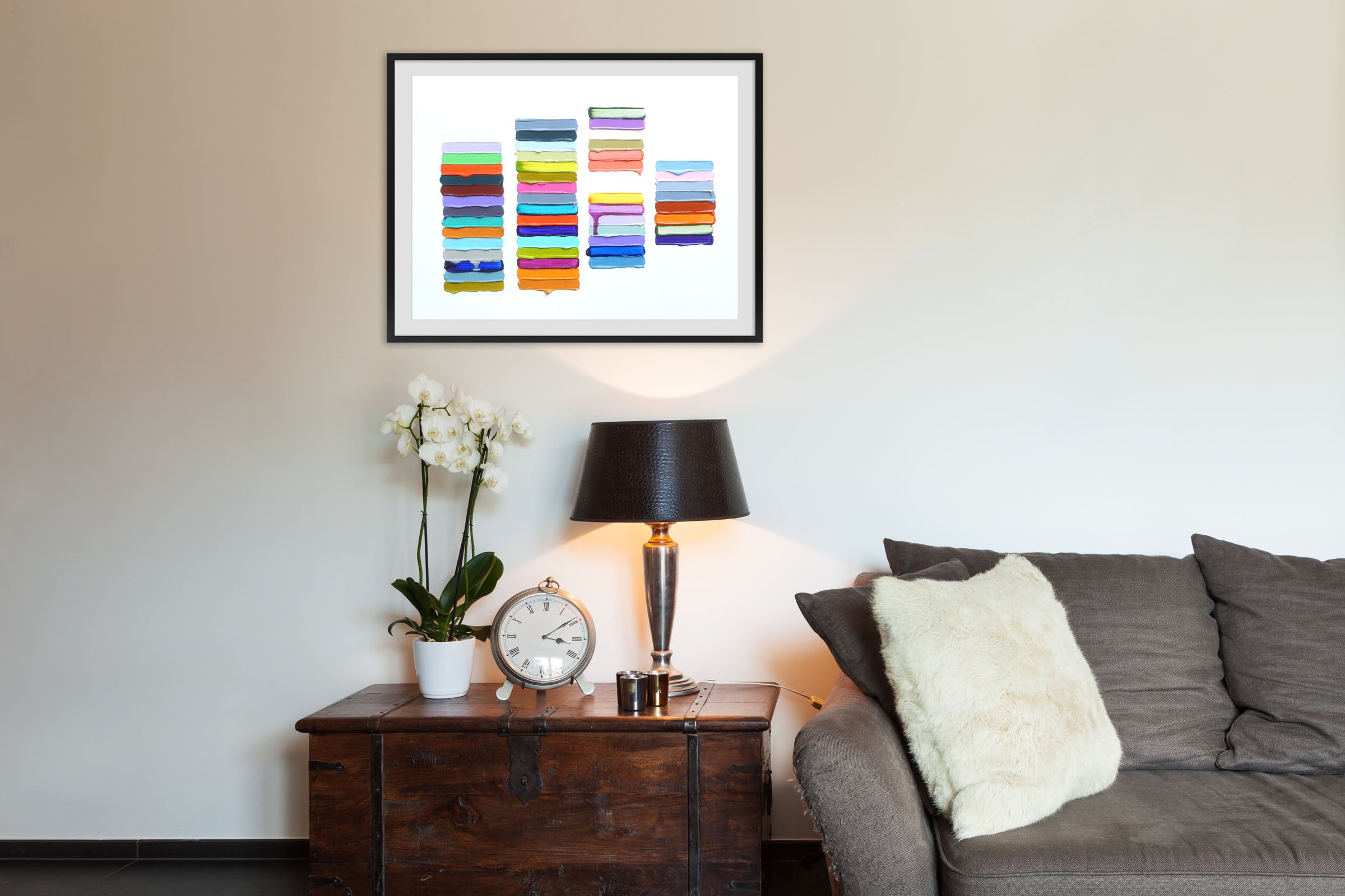A painting of a stack of colorful paint strokes on a white background.