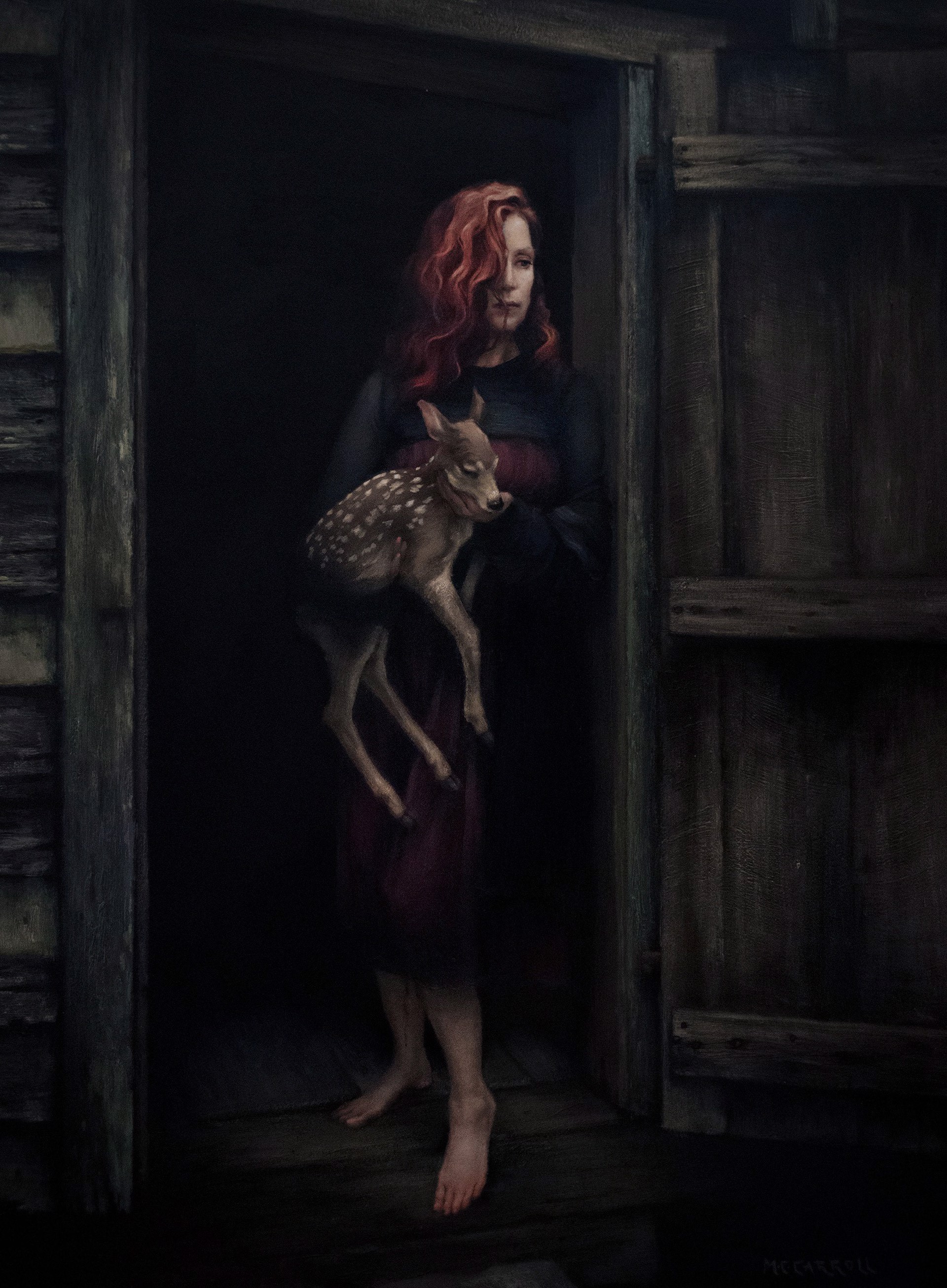 A woman holding a deer in a doorway.
