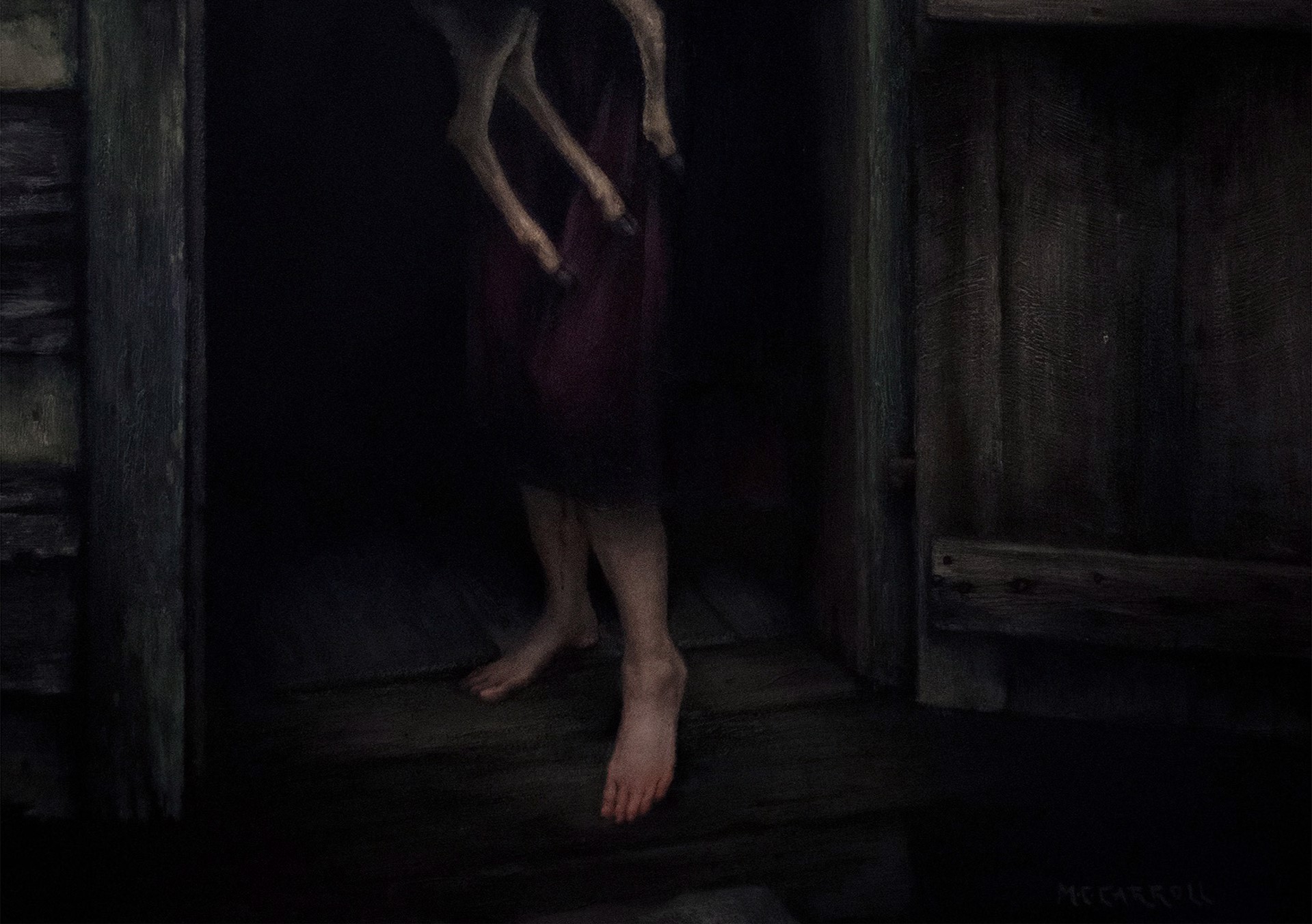 A woman holding a deer in a doorway.