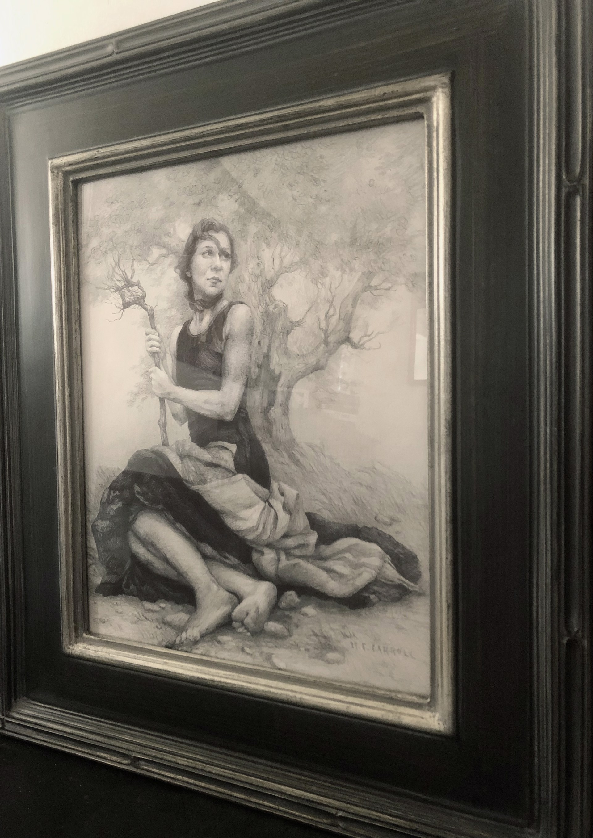 A monochromatic charcoal drawing of a seated figure holding a gnarled branch, rendered with heavy shading and dramatic lighting.