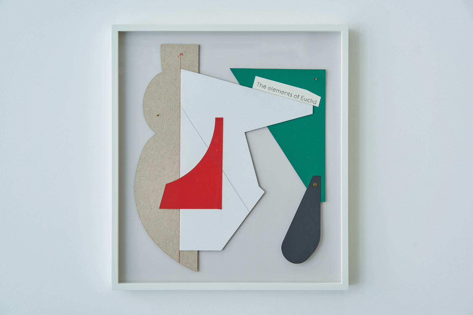 A set of four framed art pieces in a white frame.