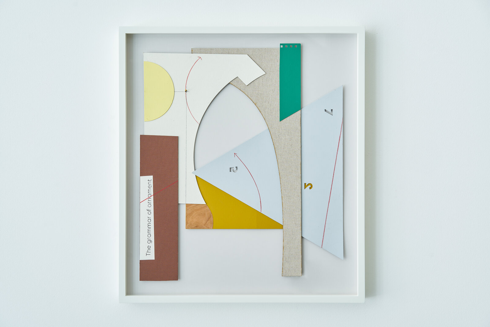 A set of four framed art pieces in a white frame.