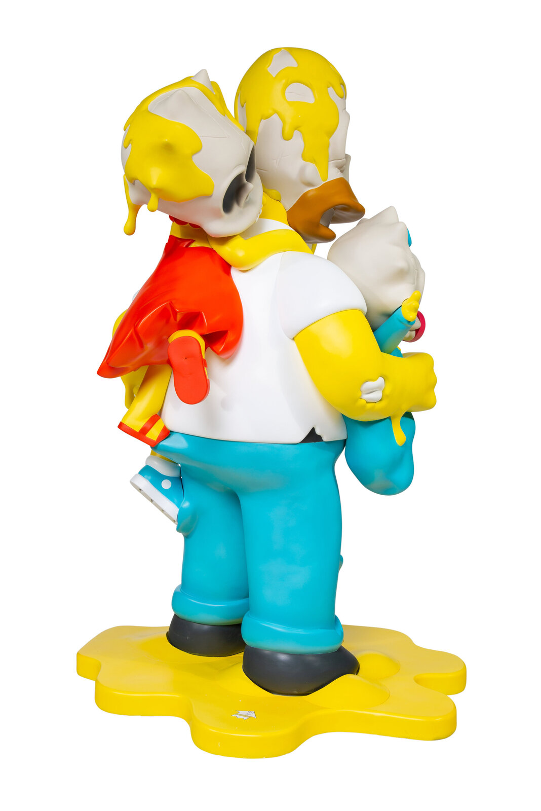 A colorful sculpture of a figure in blue overalls carrying three skulls, all smeared with yellow paint.
