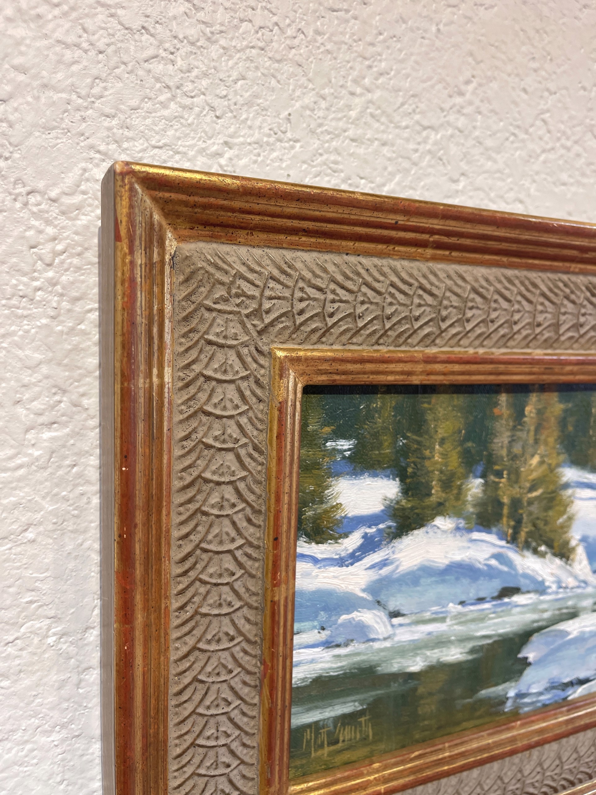 A painting of a snowy landscape with trees in the background.