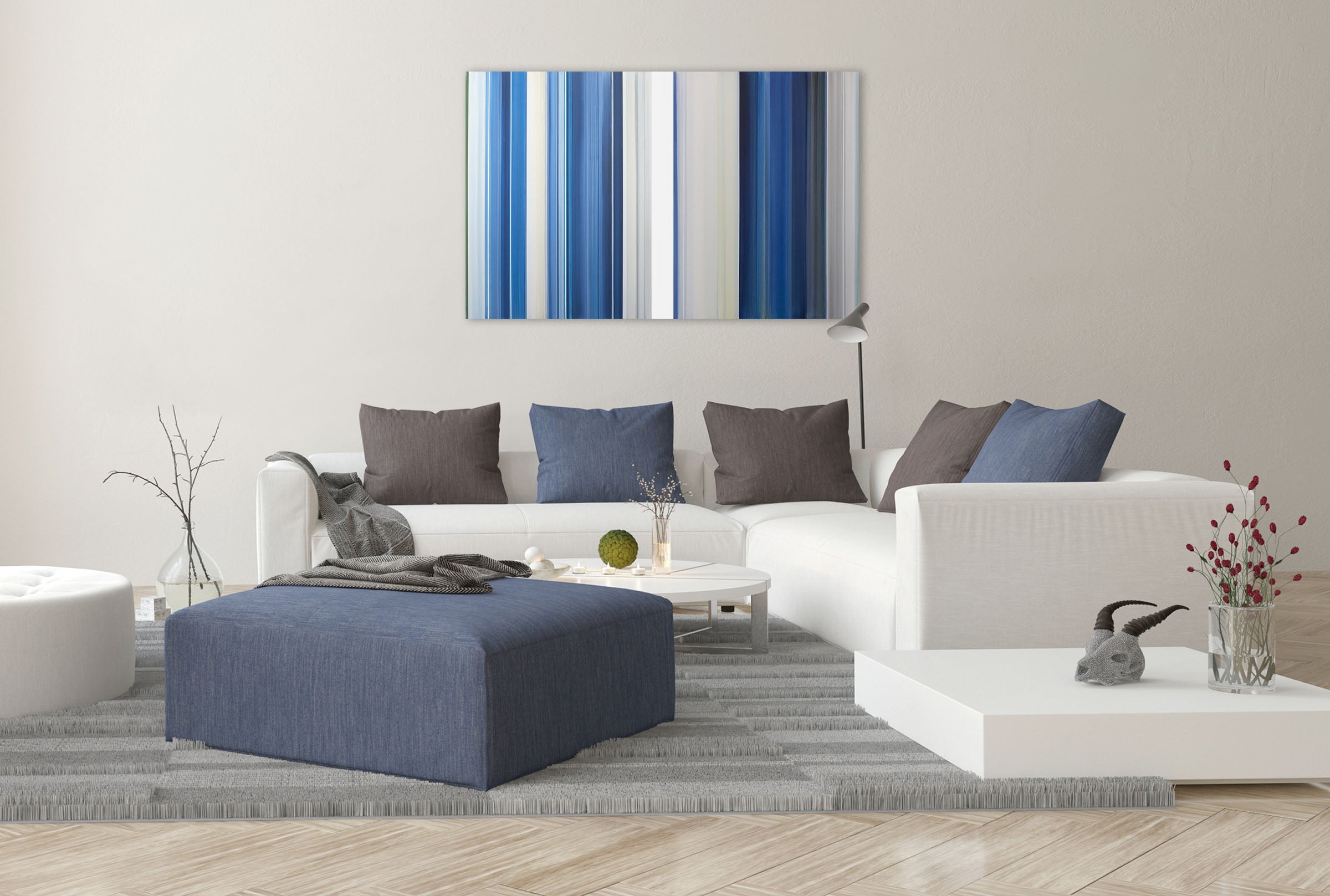 A blue and white striped painting on a white wall.