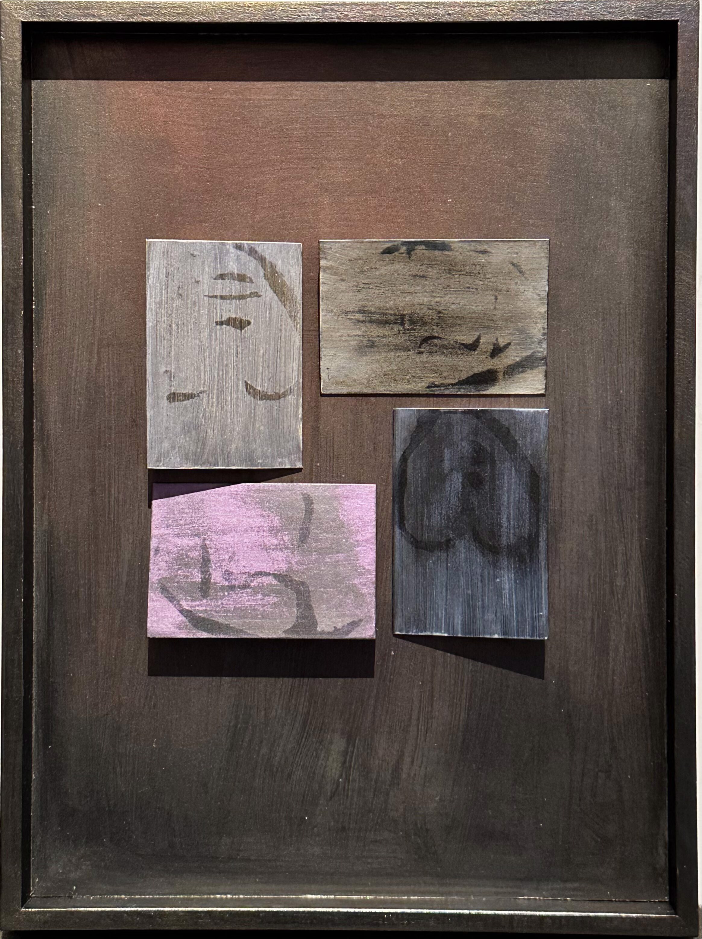 A picture of four pieces of wood with different designs on them.