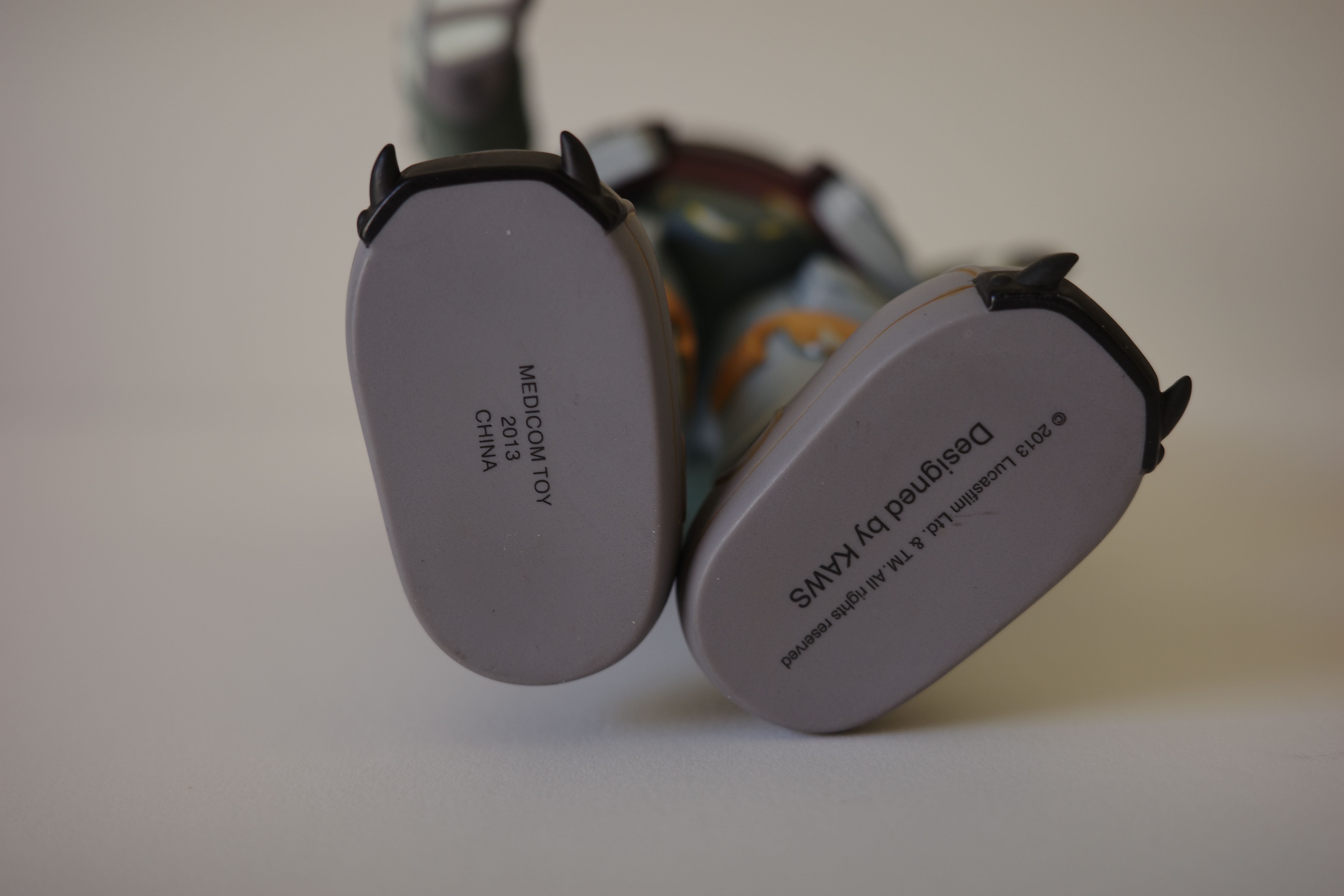 A close up of a toy figure of a boba fett.