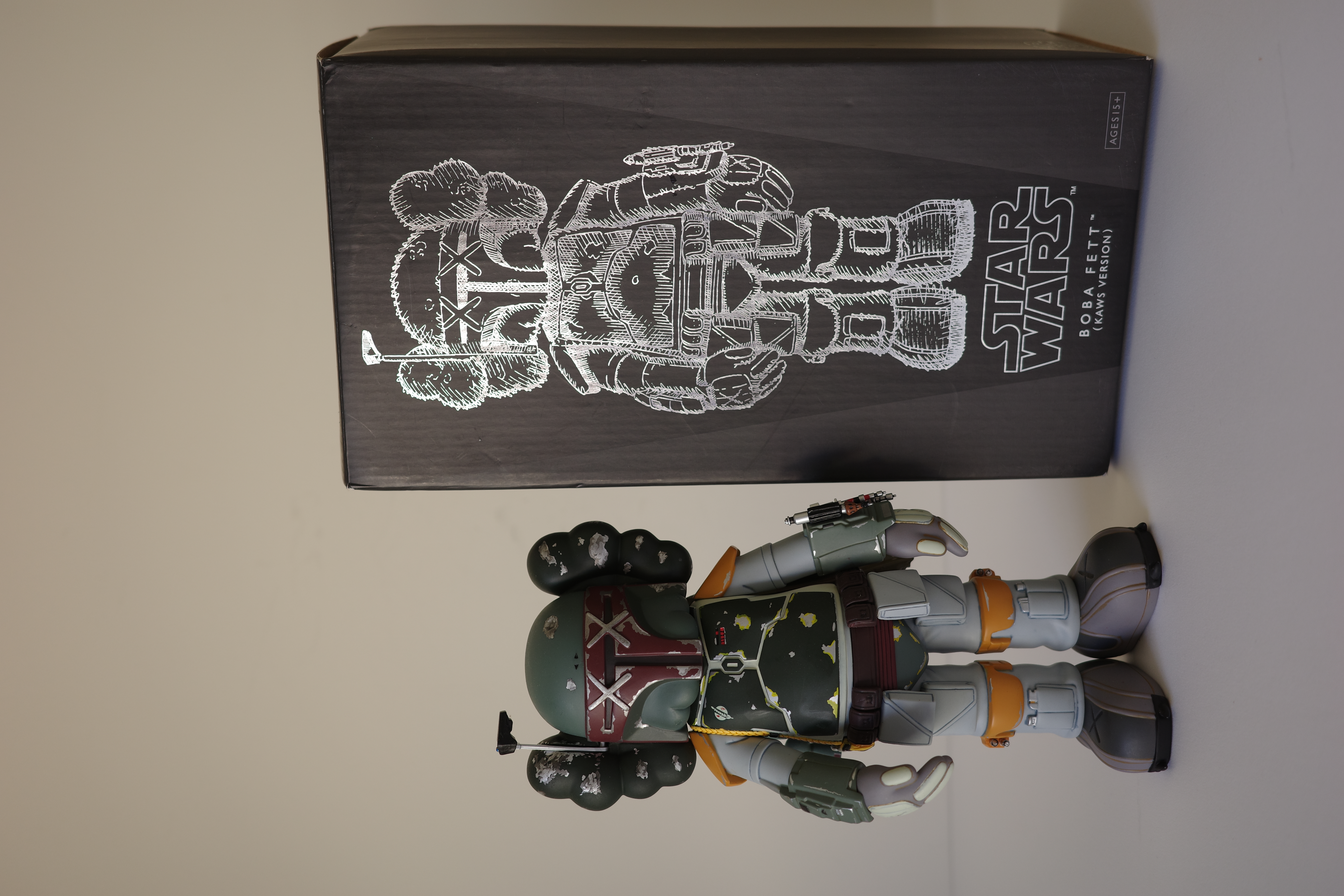 A close up of a toy figure of a boba fett.