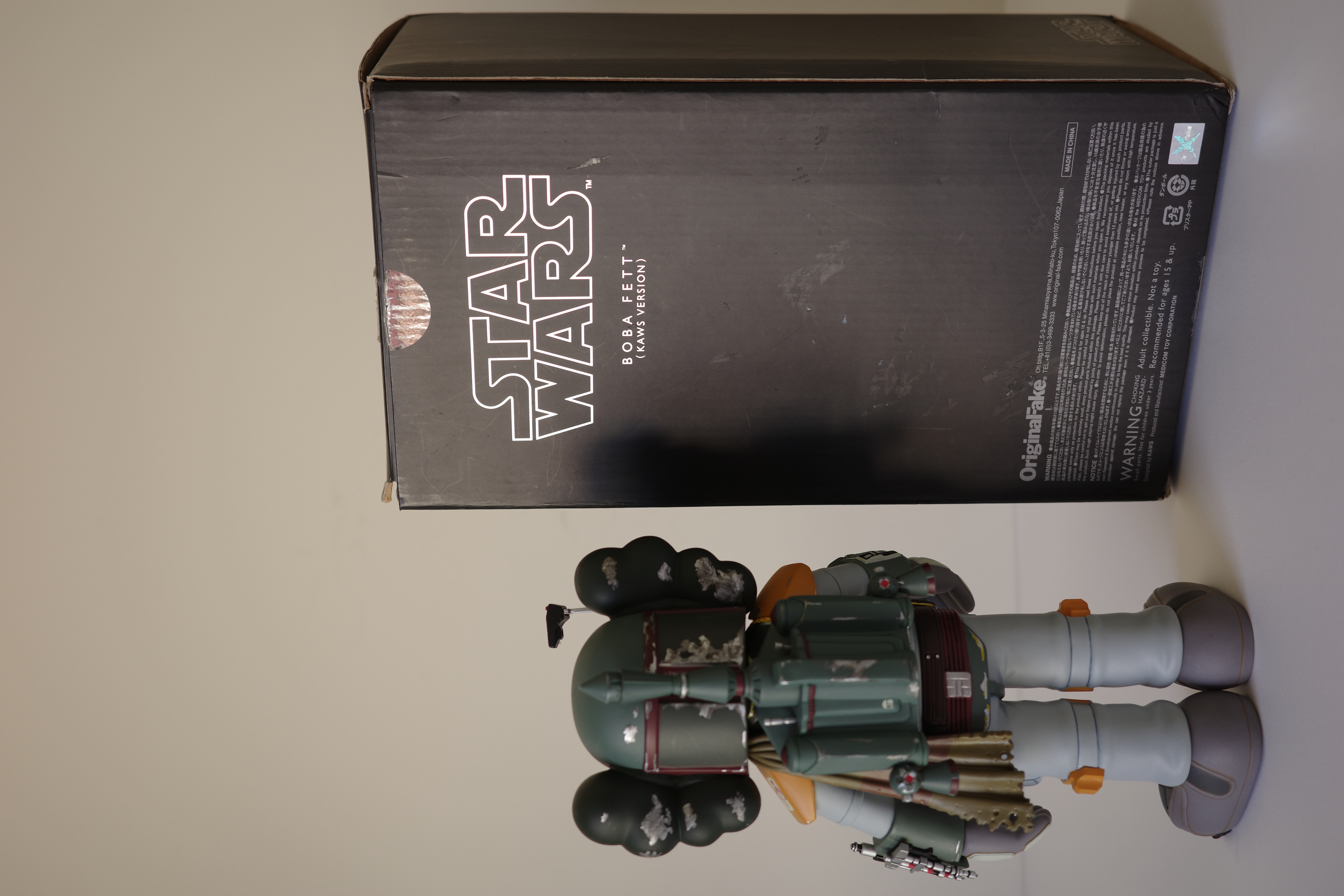 A close up of a toy figure of a boba fett.