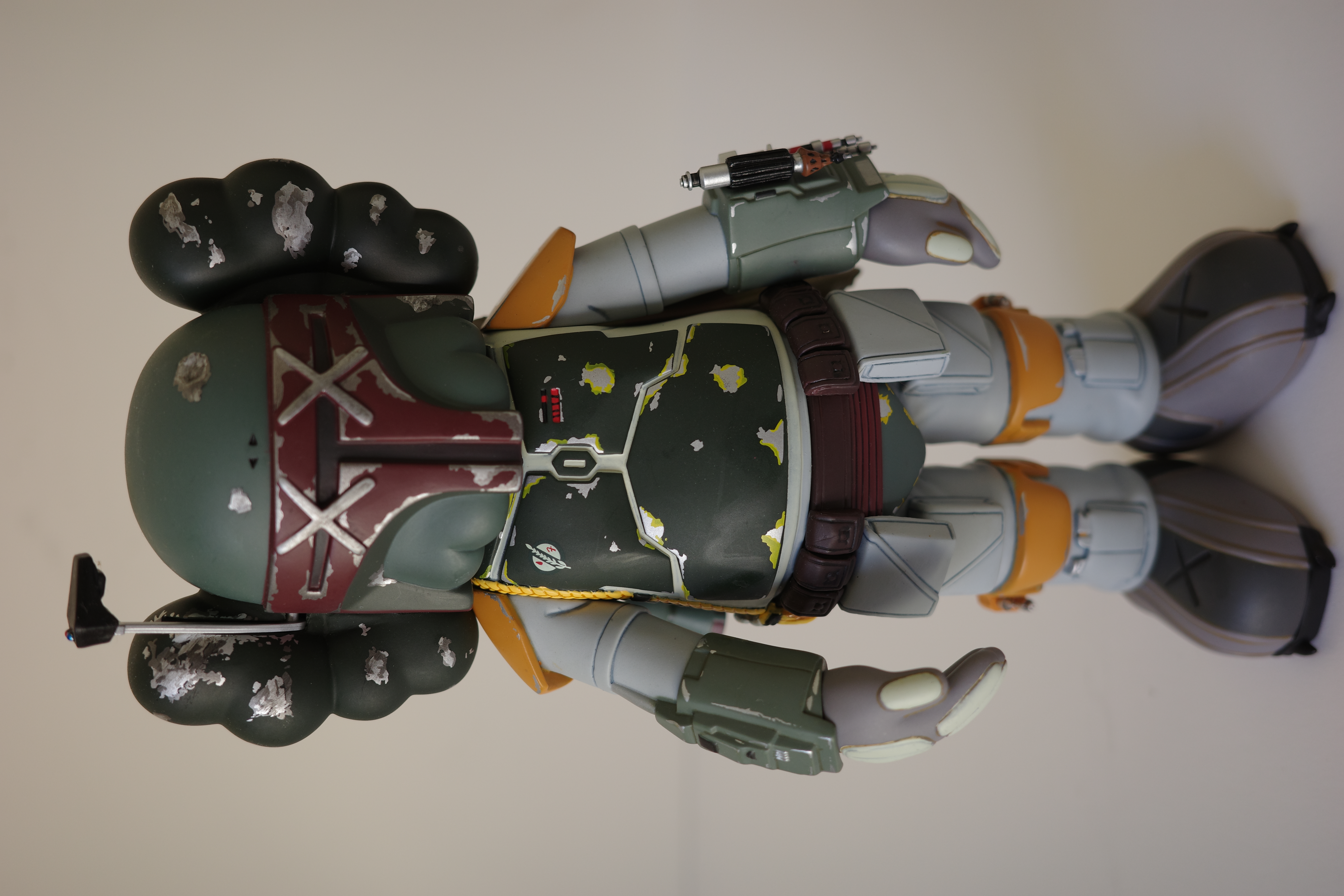 A close up of a toy figure of a boba fett.