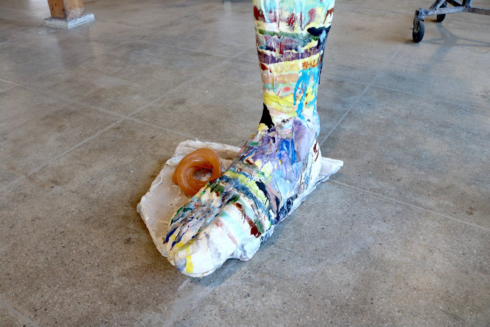 Artwork by Meghan Smythe, figures flanking a sacred tree, Made of Ceramic, Glaze, plasticine, epoxy, rubber band 