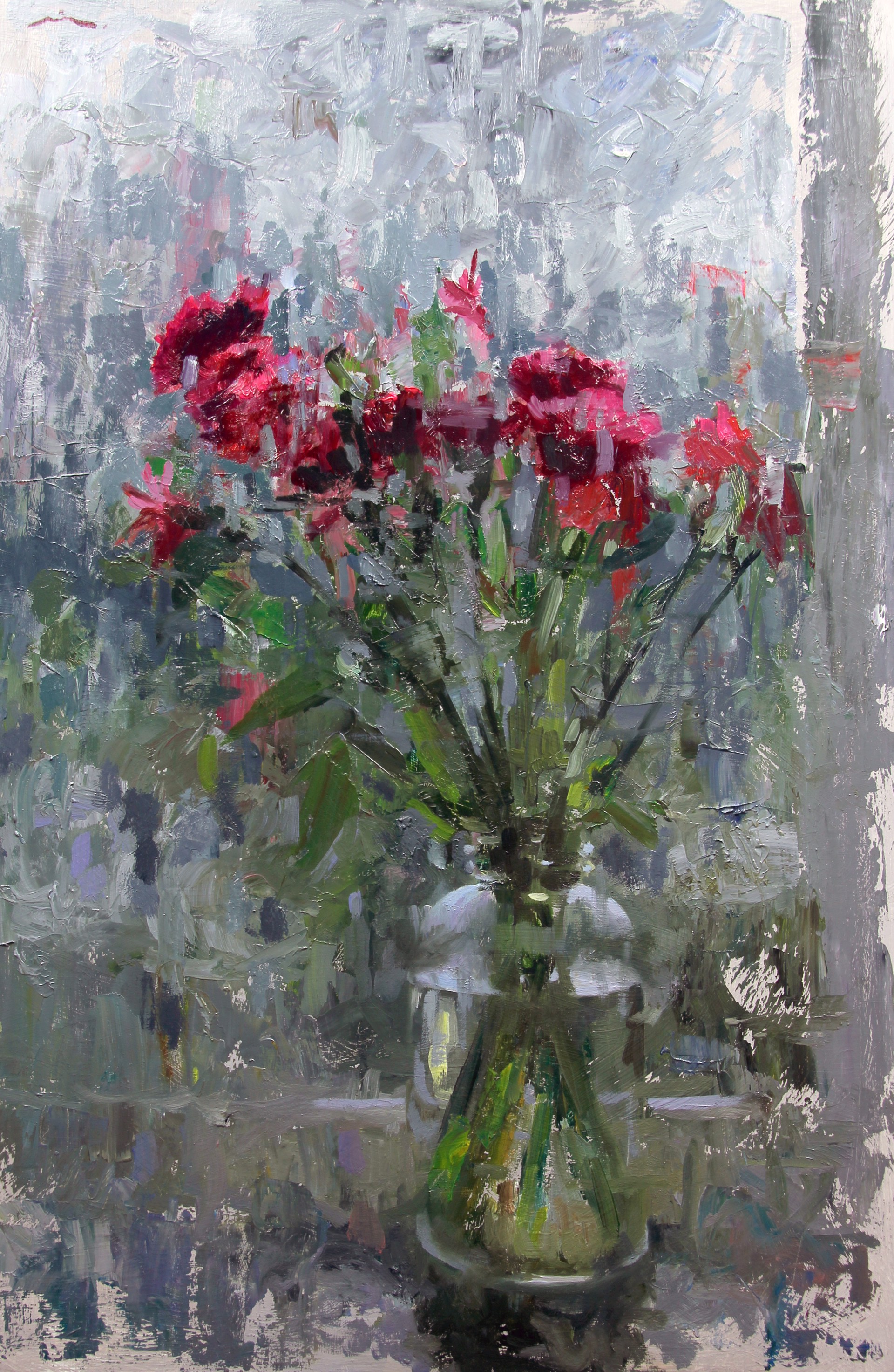 A vibrant floral arrangement in a clear glass vase set against an abstract, textured background.