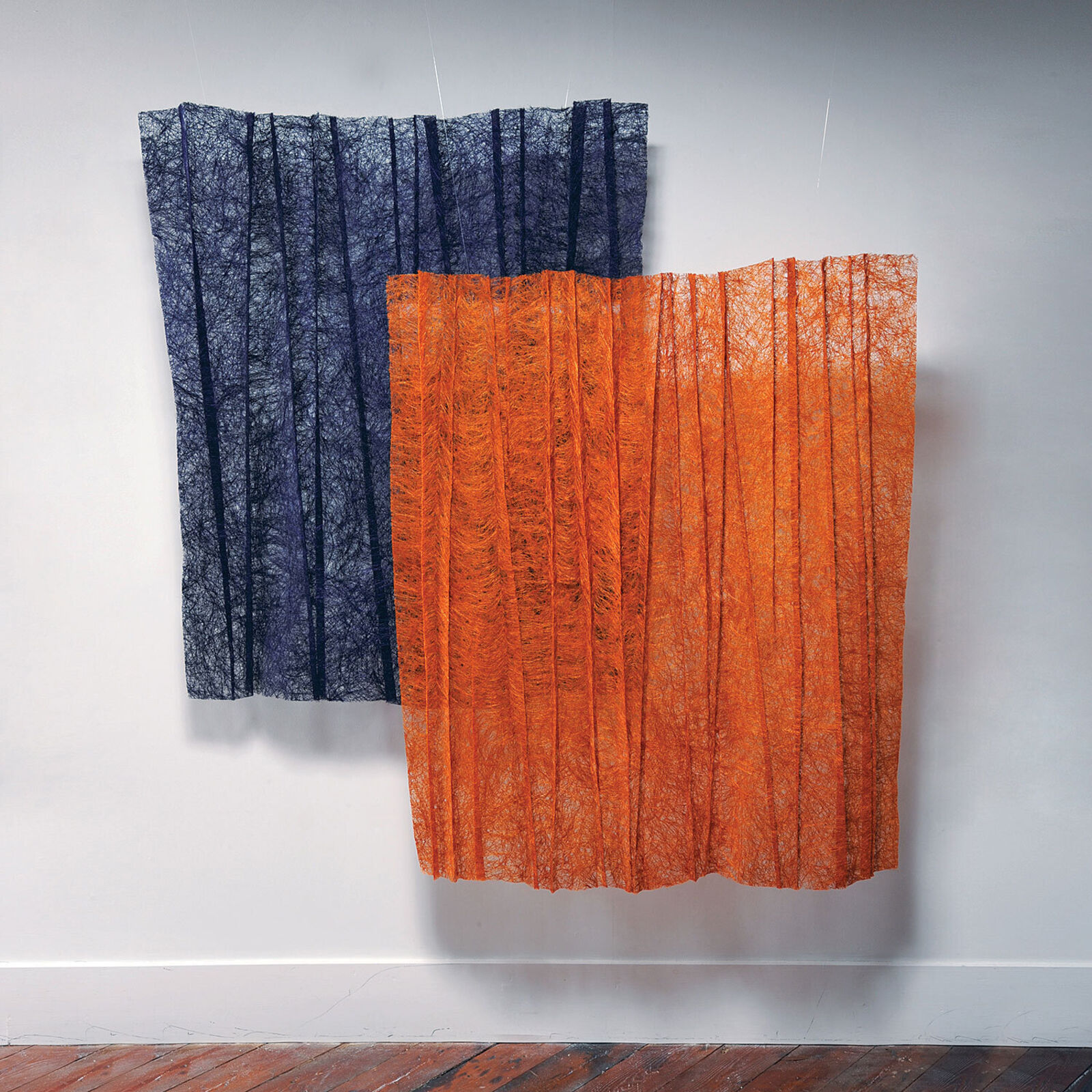 A textured textile artwork featuring vertical purple stripes on a white background.