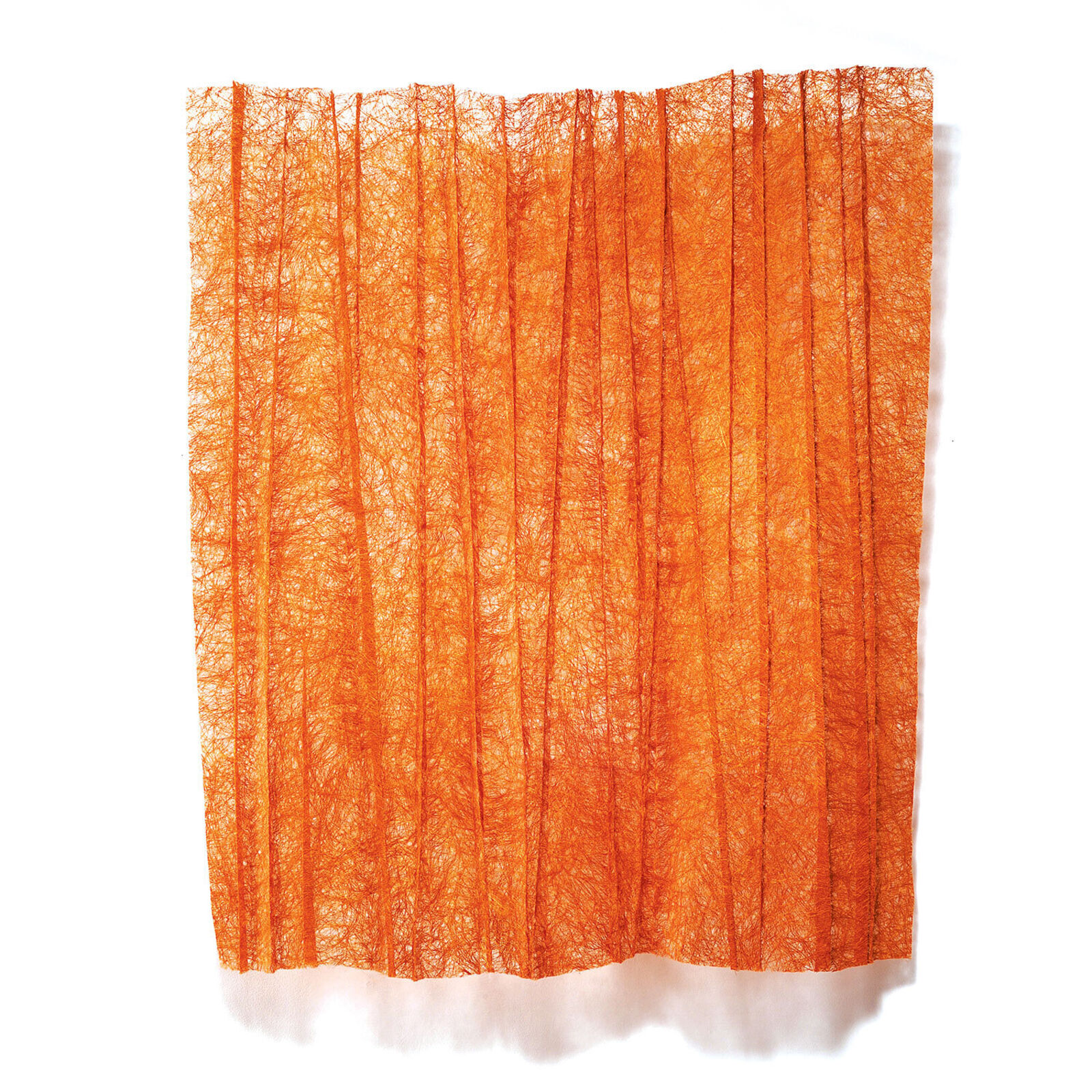 A vibrant orange textile artwork featuring a dense, forest-like pattern of vertical lines.