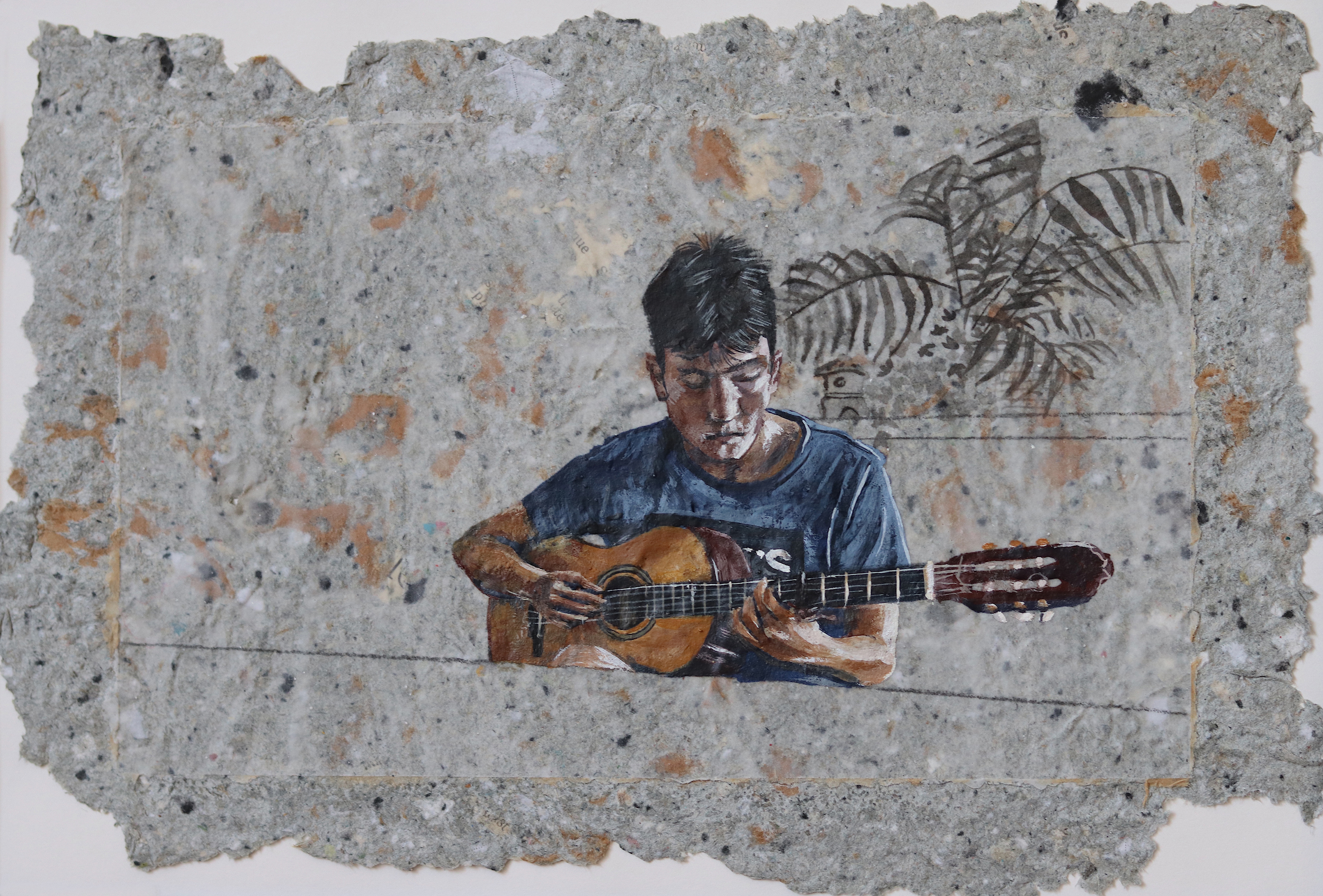 A painting of a man playing a guitar on a wall.