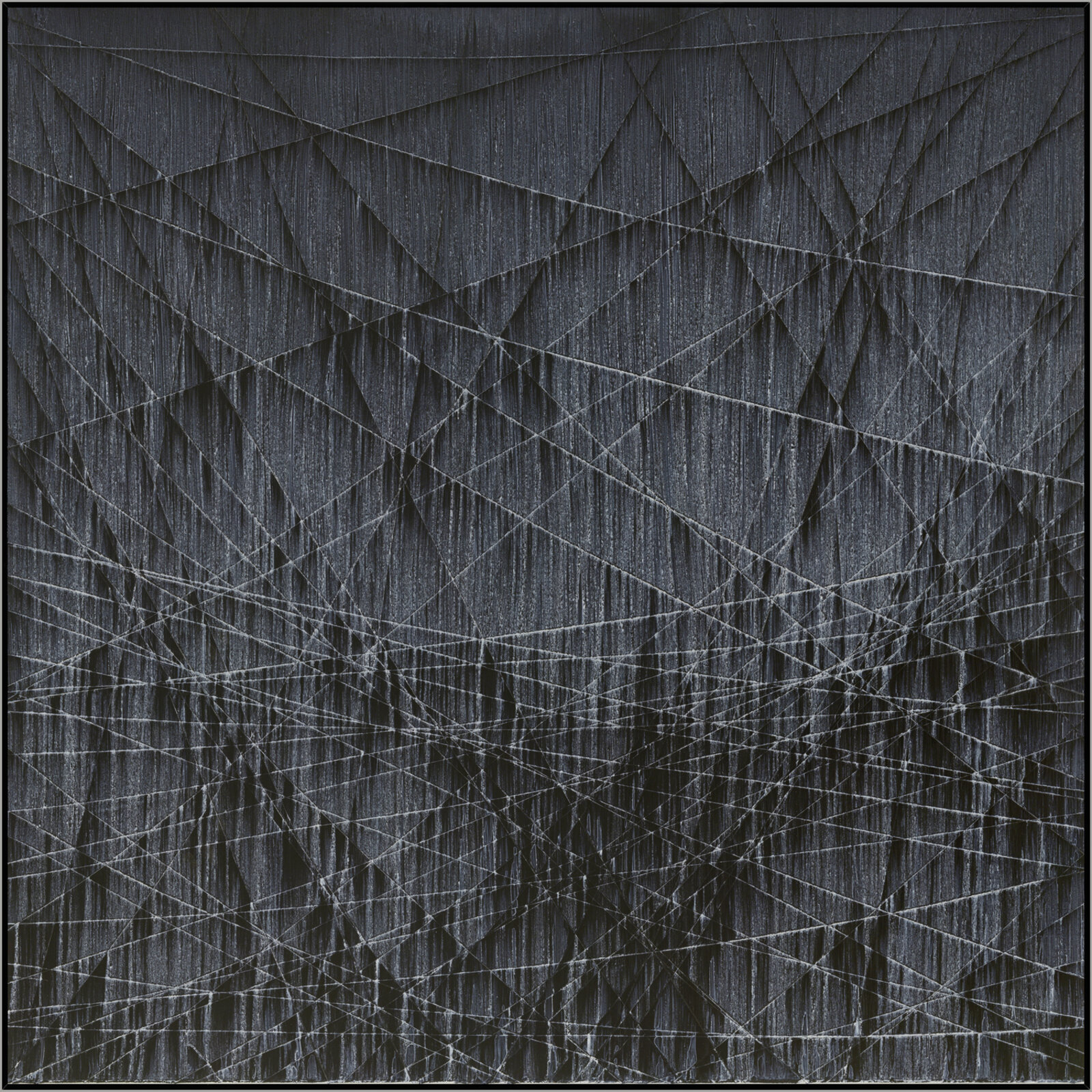 A monochromatic abstract composition featuring a dark, textured surface crisscrossed by a dense network of white geometric lines.