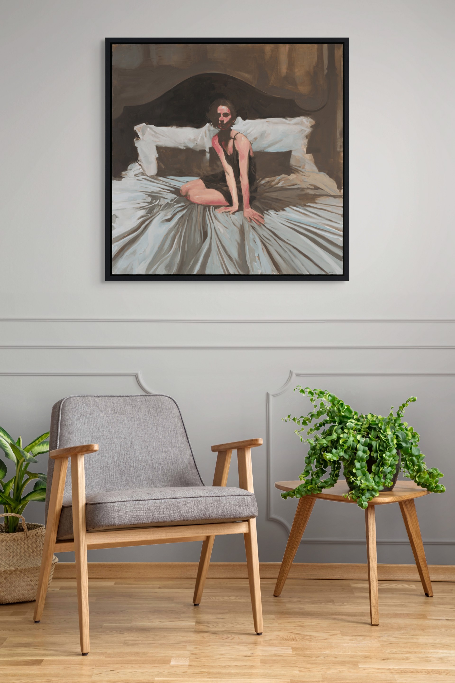 A figure sits on a bed in a dimly lit, intimate bedroom scene.