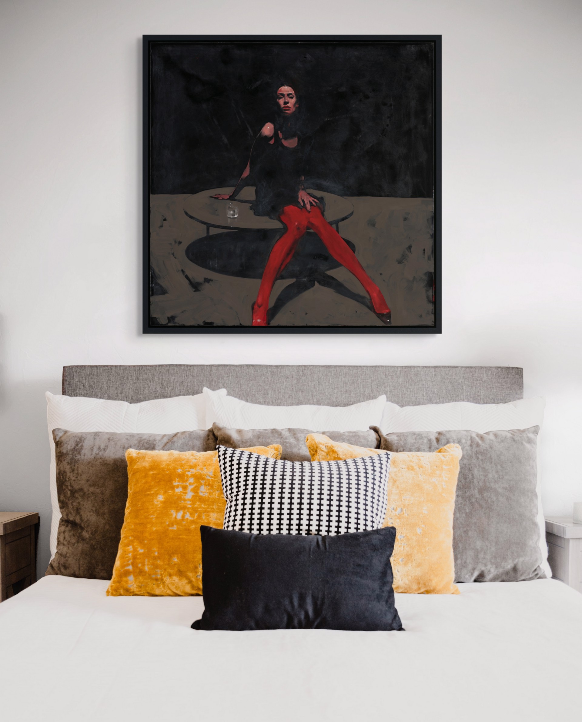 A dramatic painting of a figure in red tights seated at a table against a dark background.