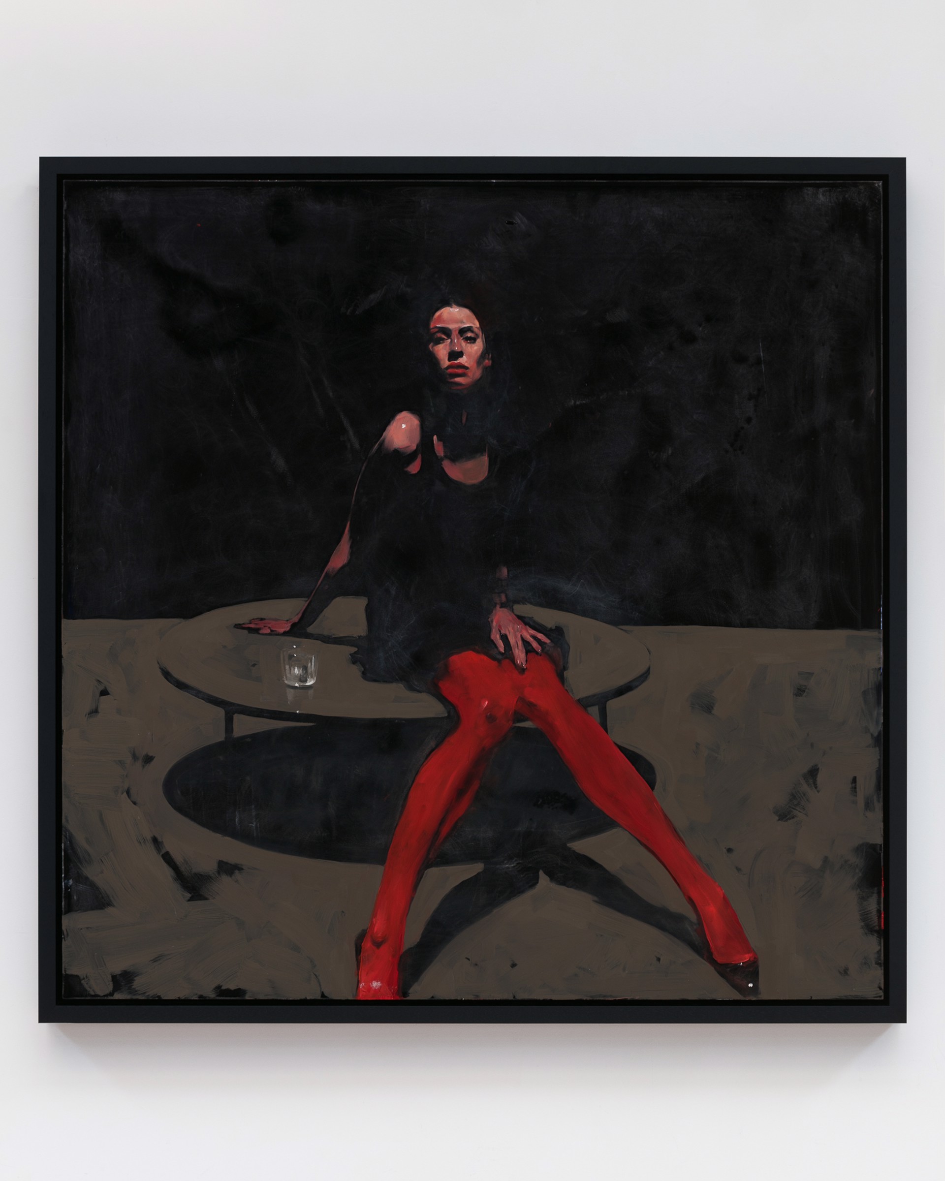 A dramatic painting of a figure in red tights seated at a table against a dark background.