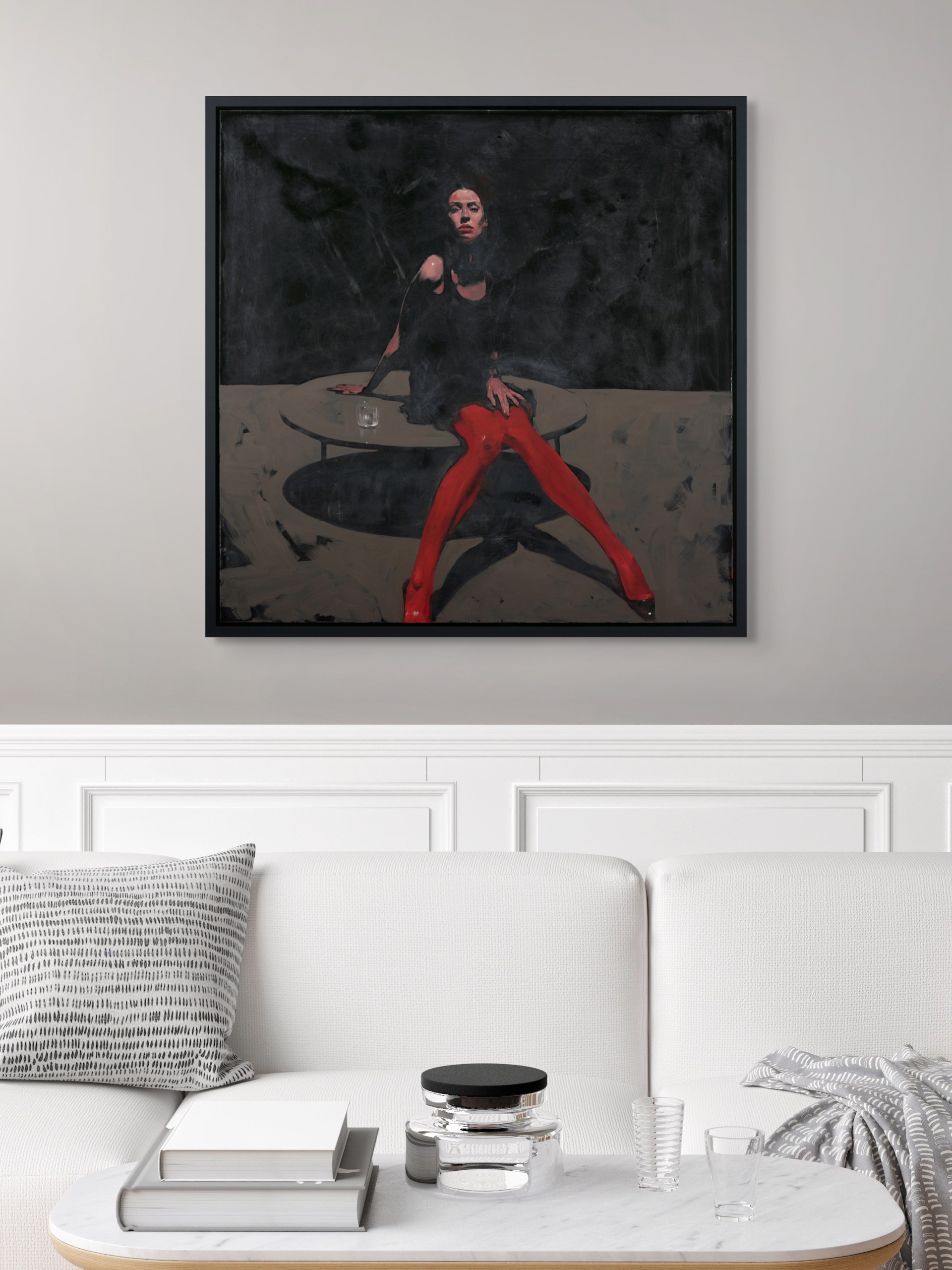 A dramatic painting of a figure in red tights seated at a table against a dark background.