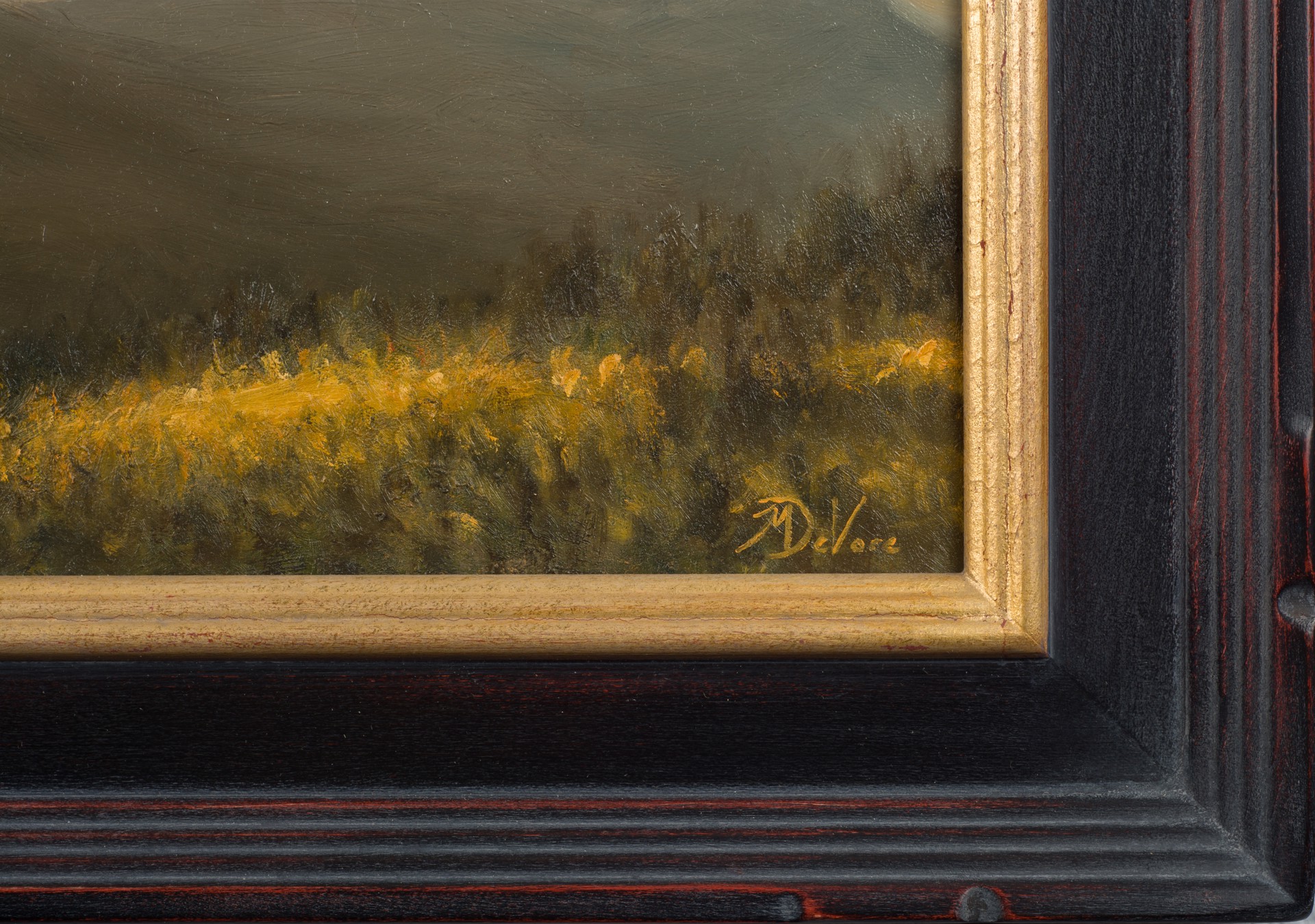 A painting of a sunset over a mountain range.