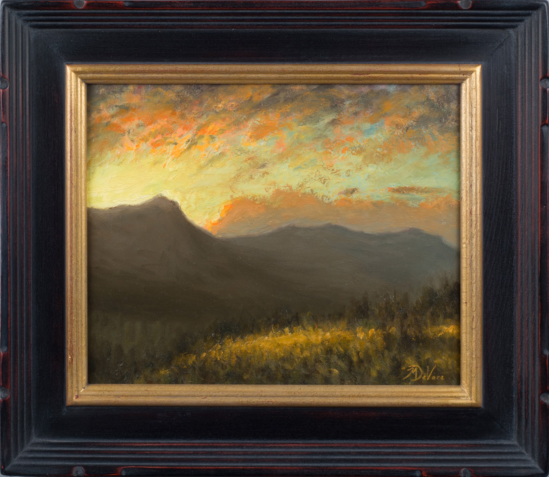 A painting of a sunset over a mountain range.