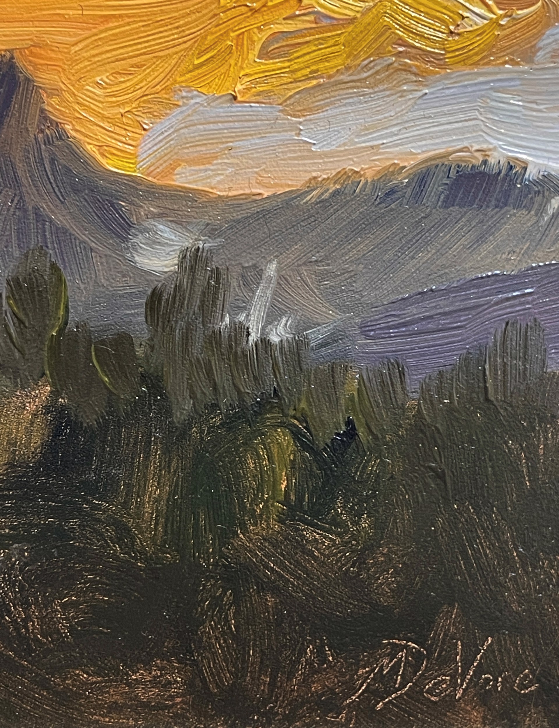 A painting of a sunset over a mountain range.