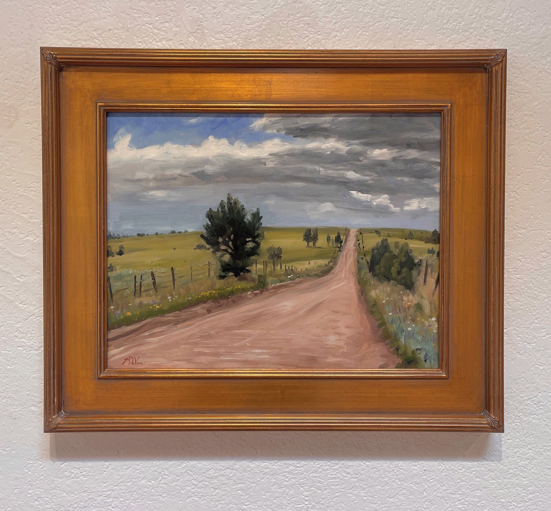 A painting of a dirt road in the middle of a field.