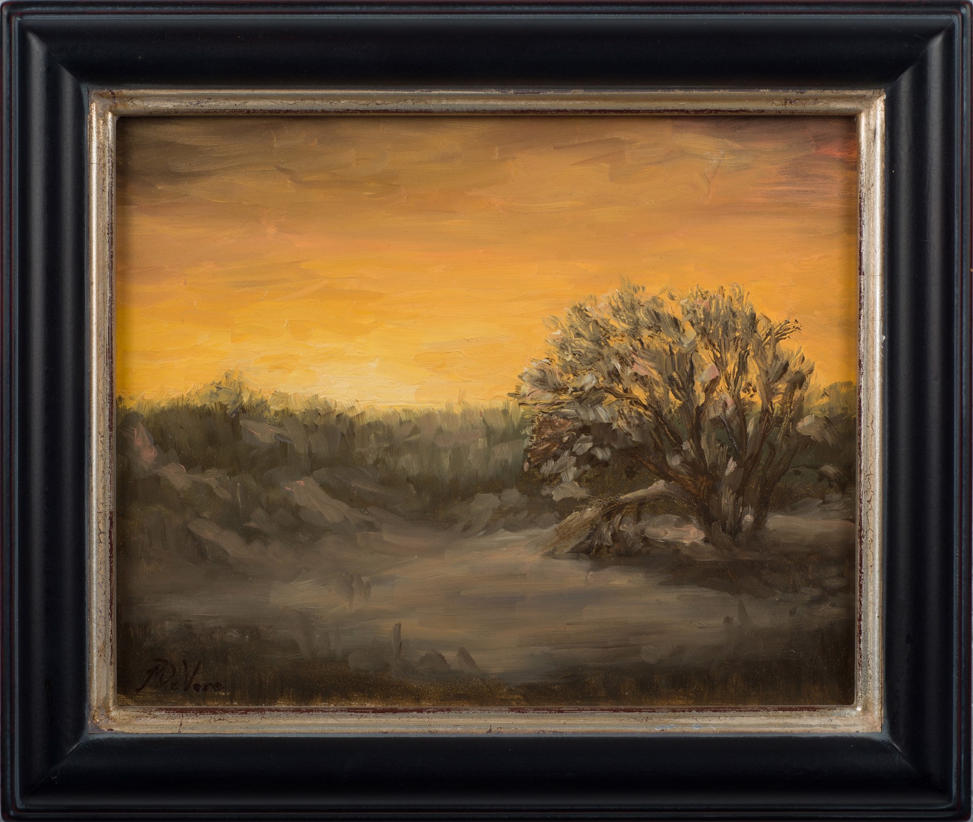 A painting of a sunset with a lone tree in the foreground.