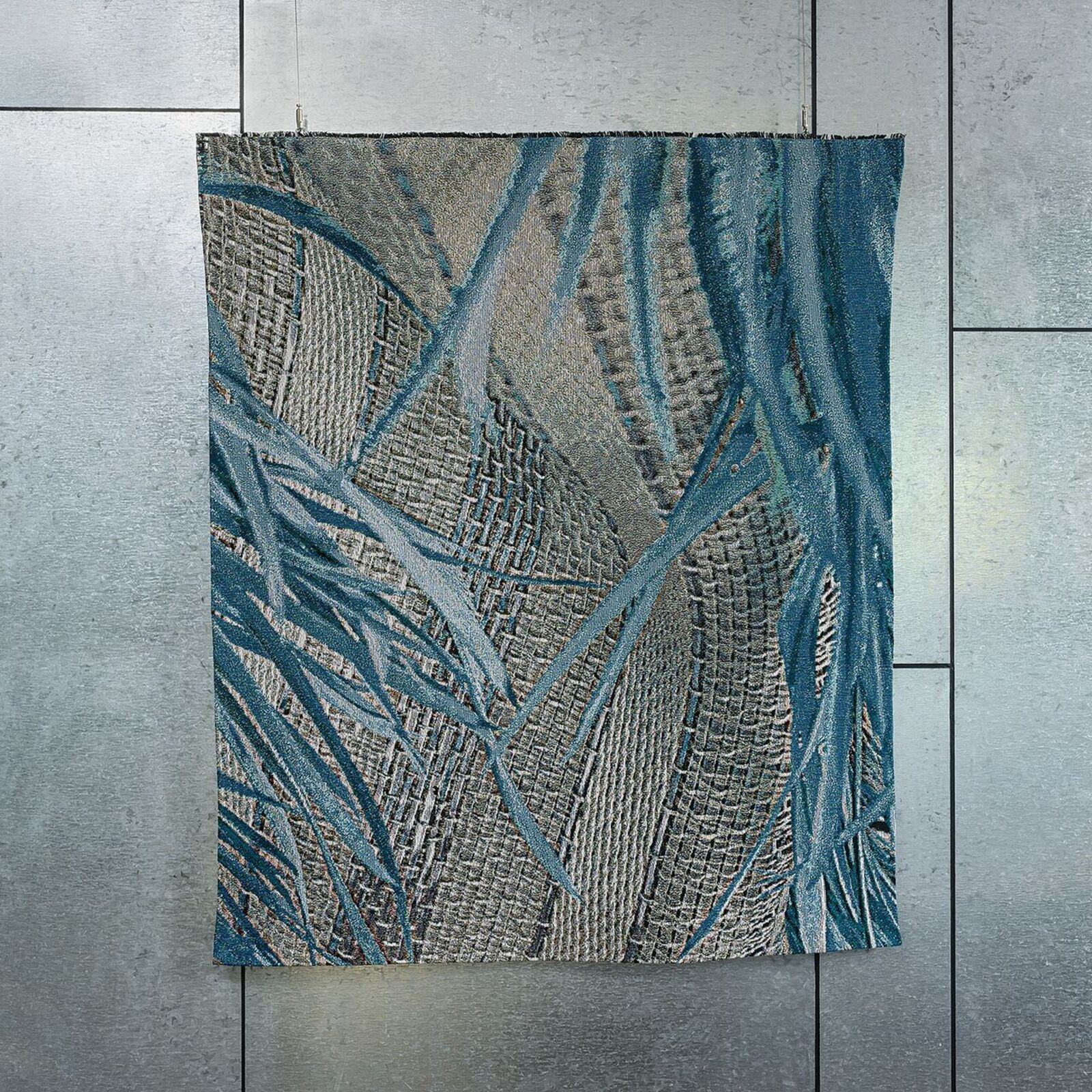 A textured abstract painting featuring woven patterns and blue leaf-like forms against a neutral background.