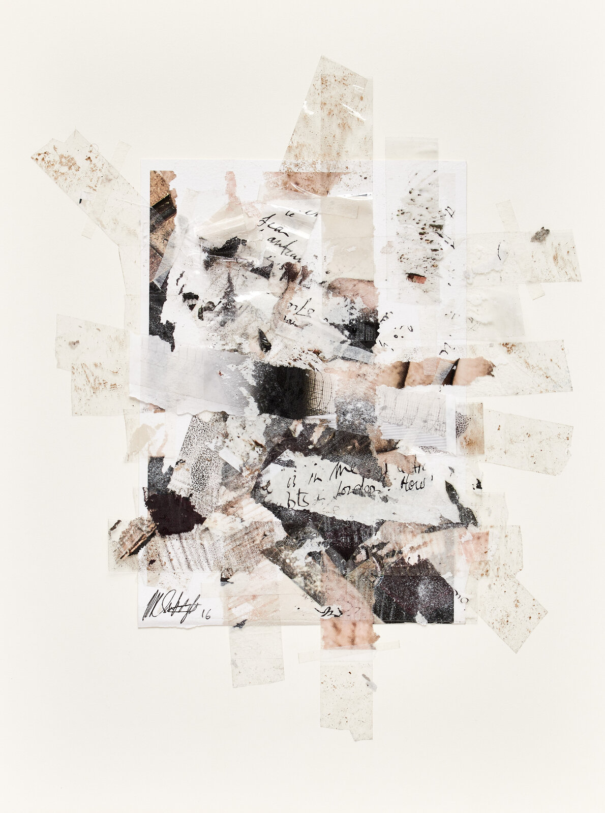 A collage of torn pieces of paper on a white surface.