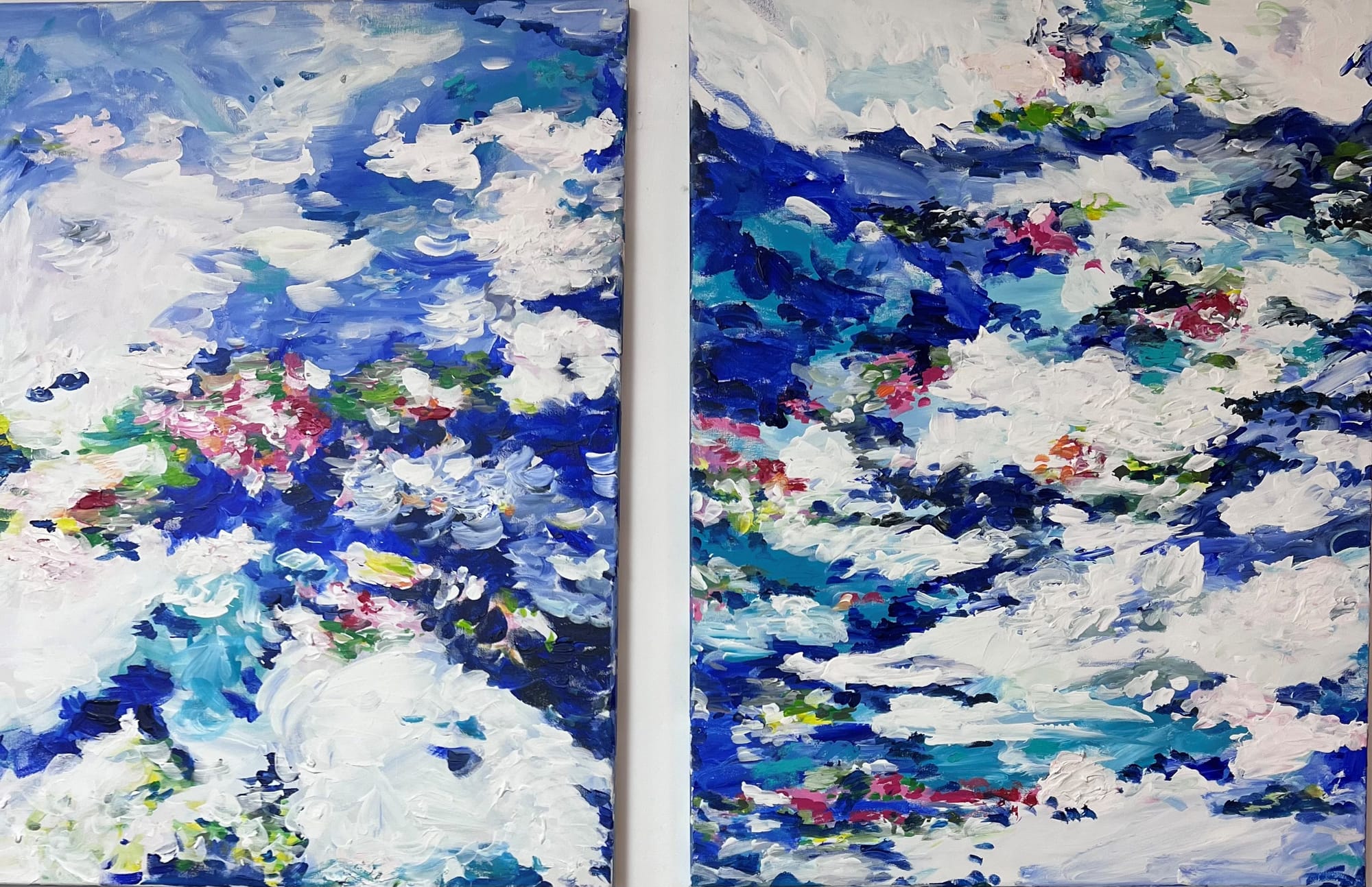 A painting of two paintings of clouds on a wall.
