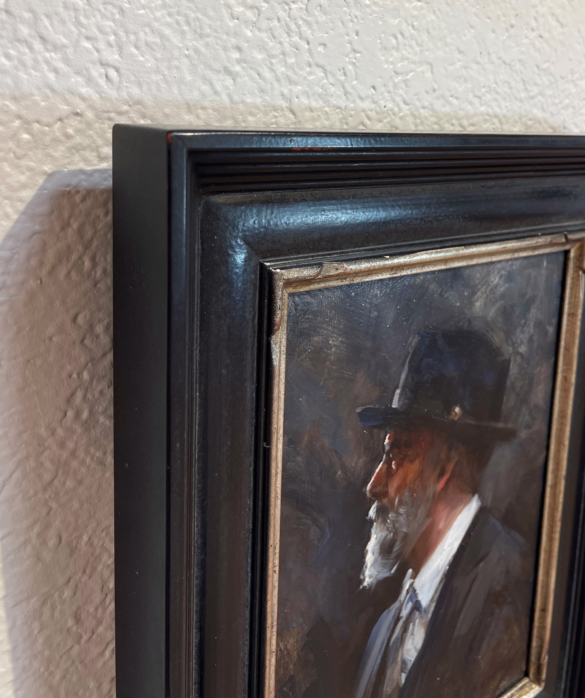 A painting of a man with a white beard and a black hat.