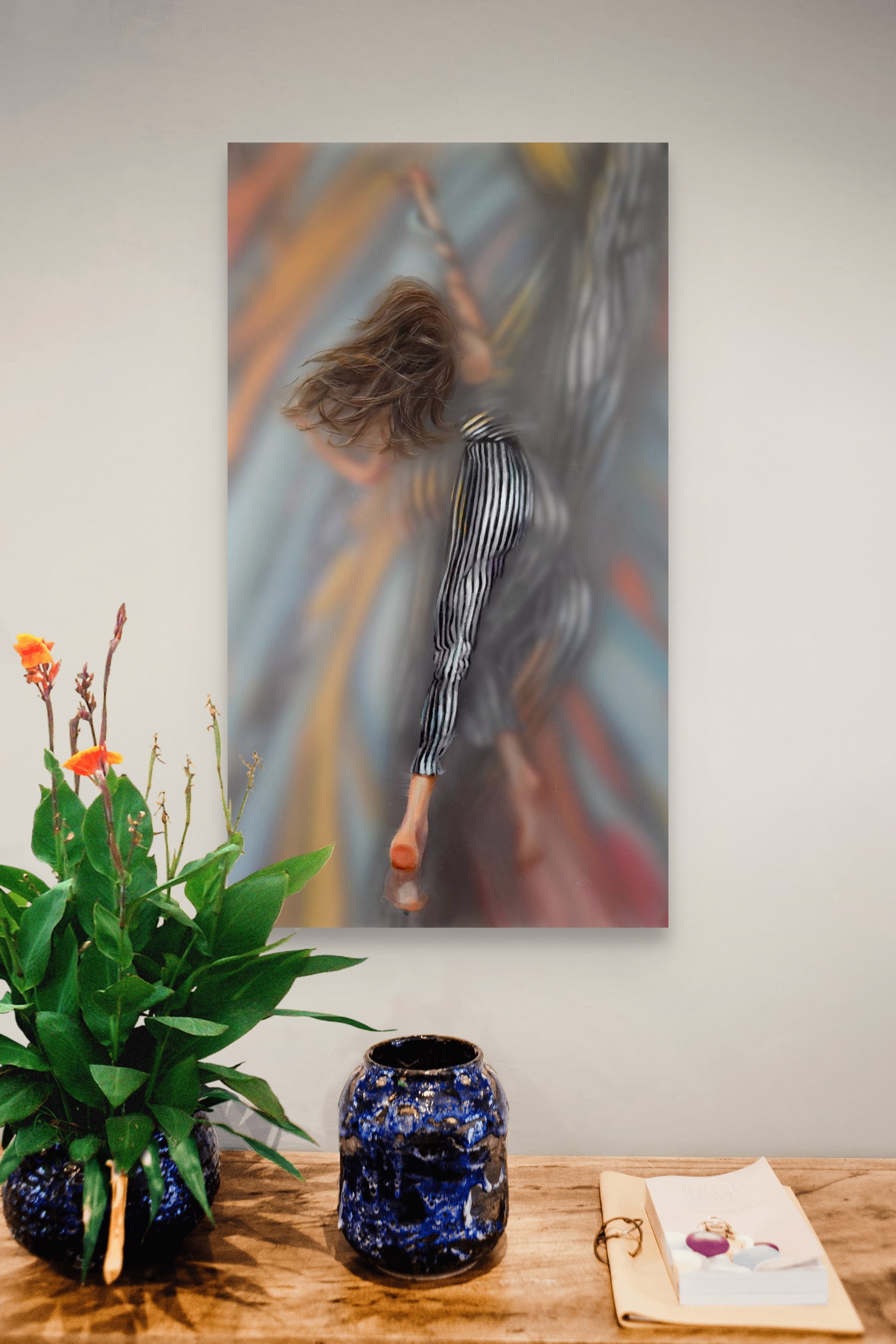 A painting of a woman with her hair blowing in the wind.