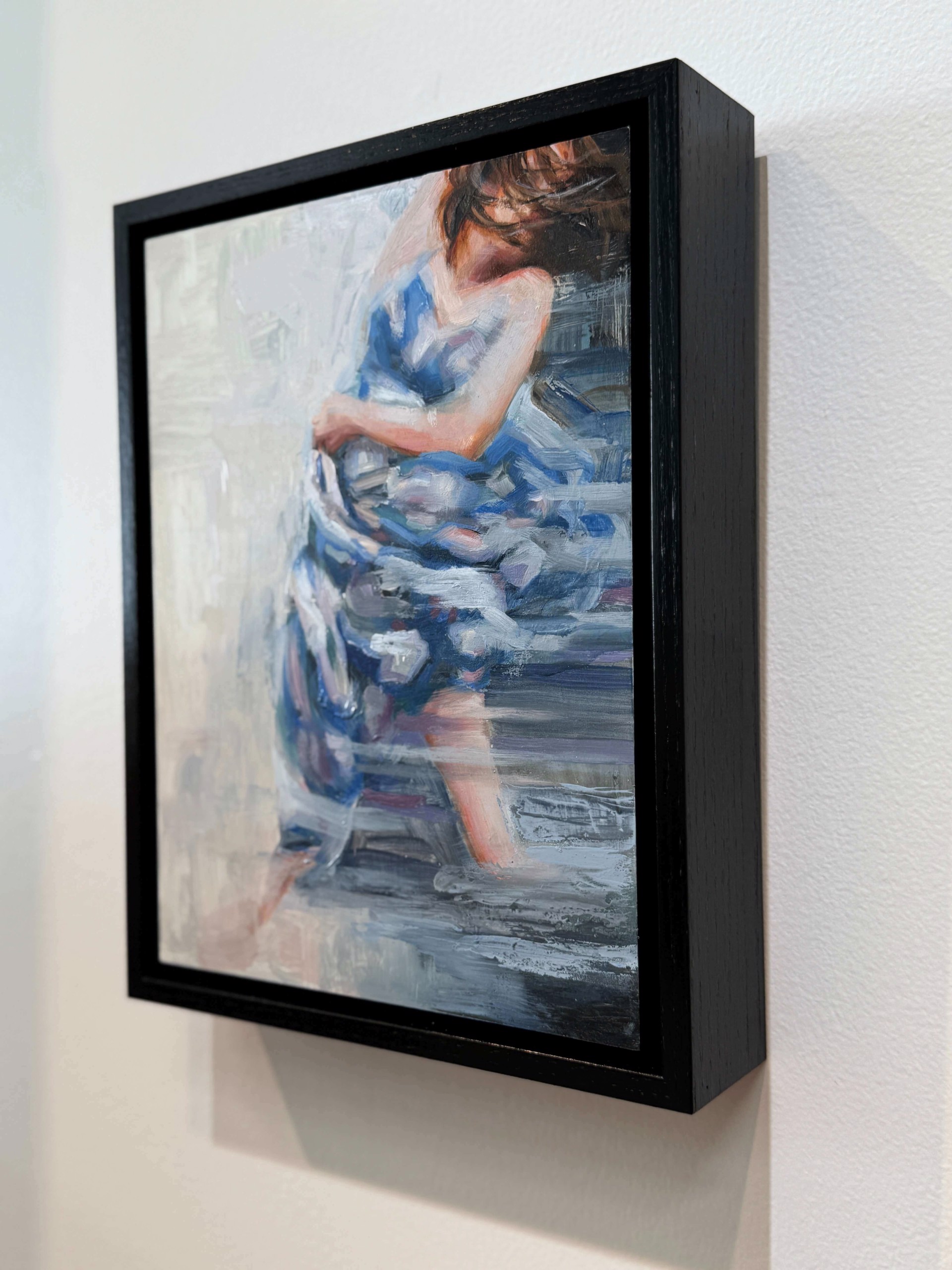 A painting of a woman in a blue dress.