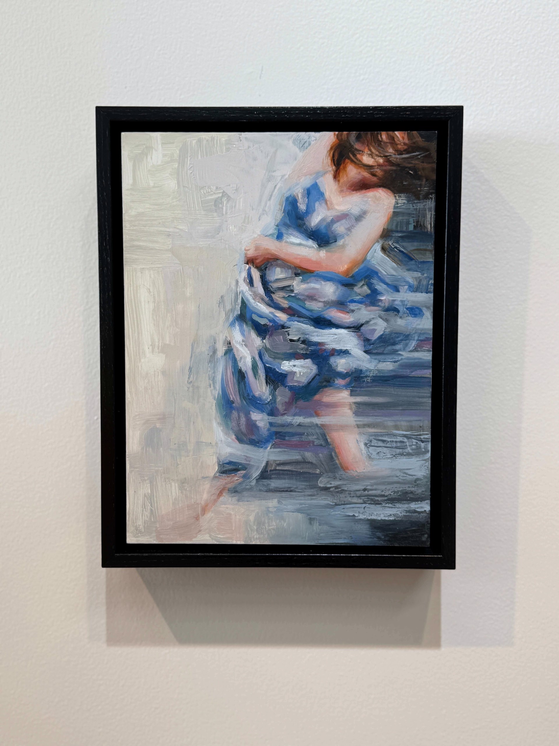 A painting of a woman in a blue dress.