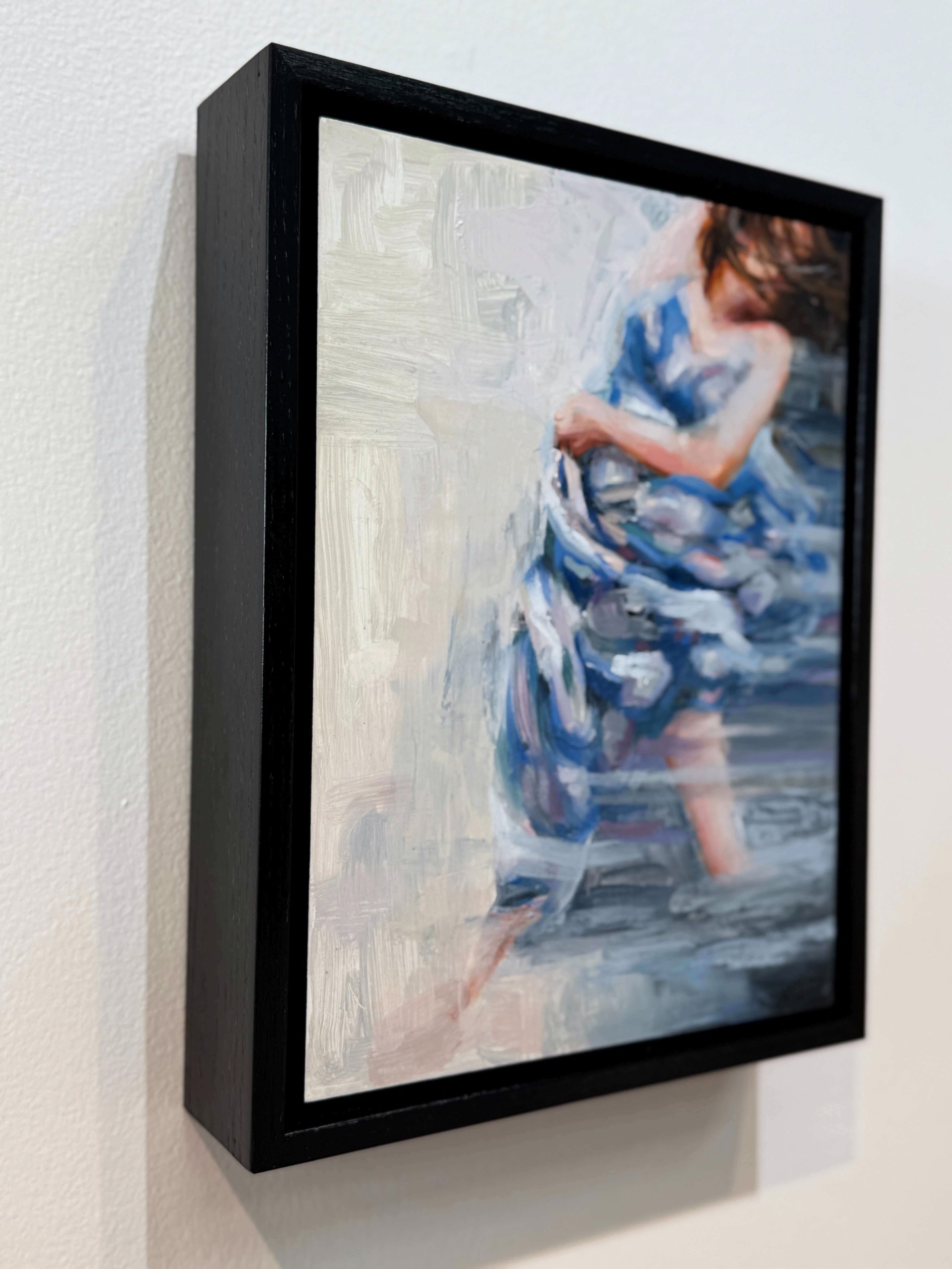 A painting of a woman in a blue dress.