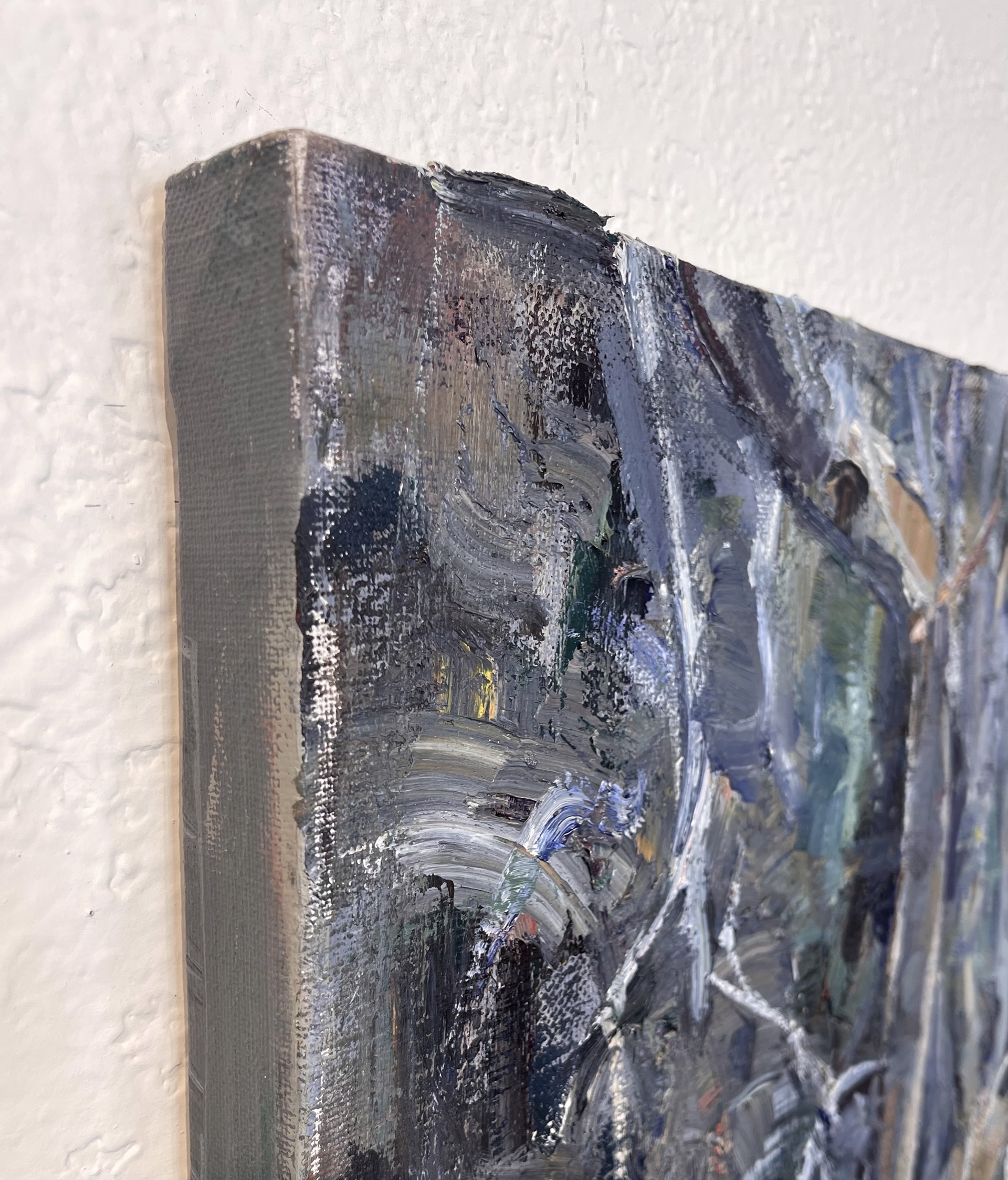 A painting of rocks and trees in the woods.