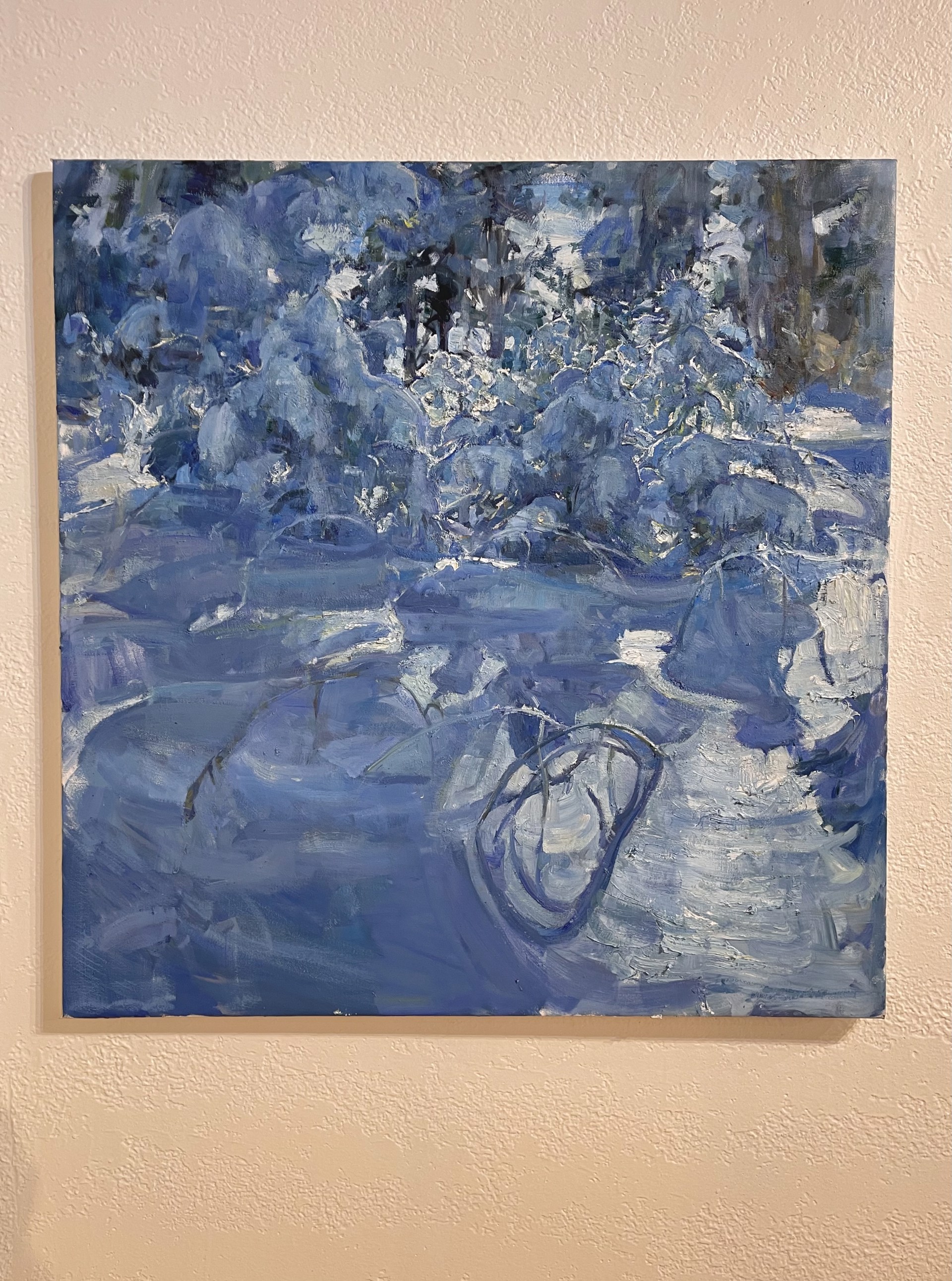 A painting of a snowy landscape with trees in the background.